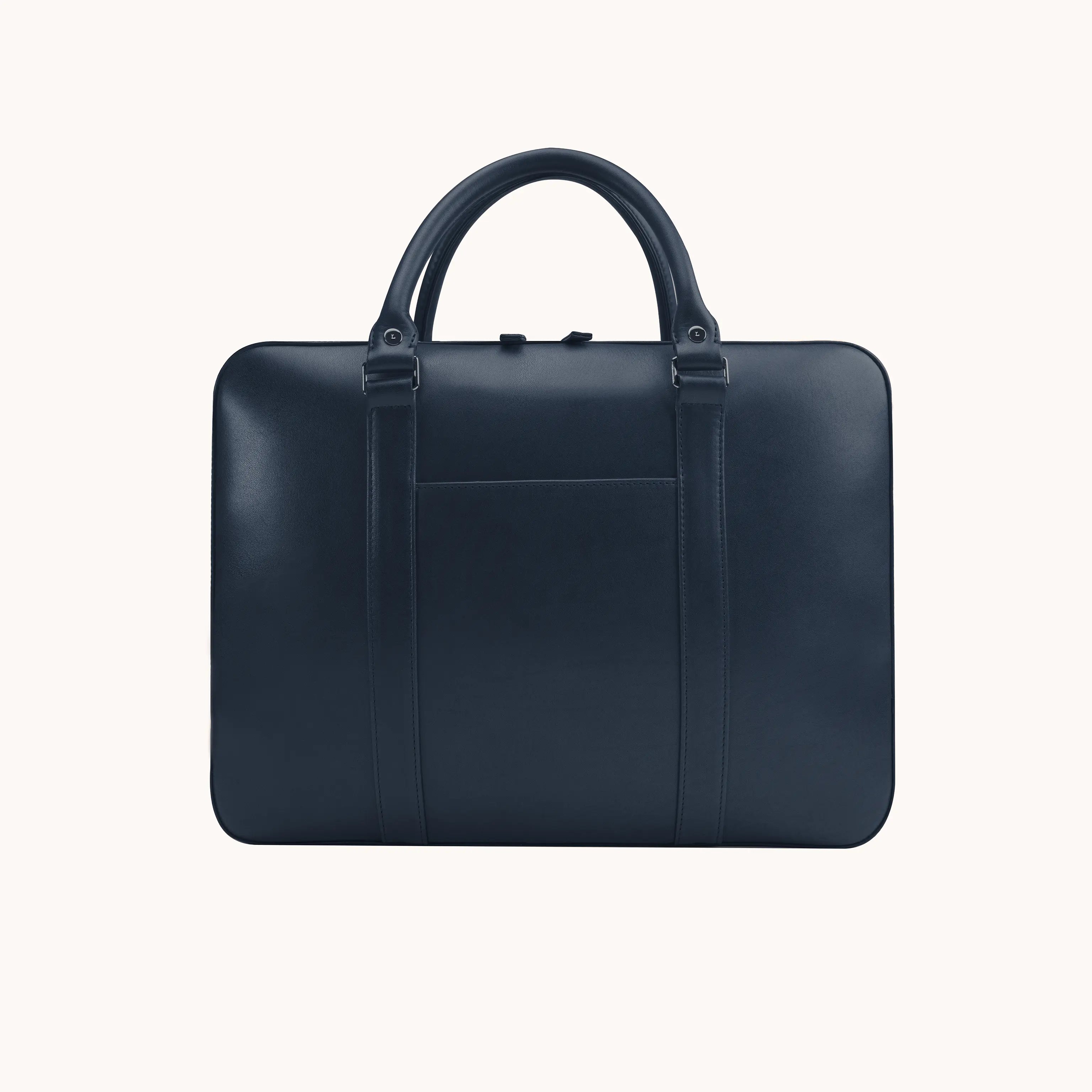 Lunburg Opus Briefcase in Nocturnal Sapphire vegetable-tanned Perpetual Leather (from Tempesti), front view showing exterior slip pocket, folded leather handles, and 316L stainless steel hardware.