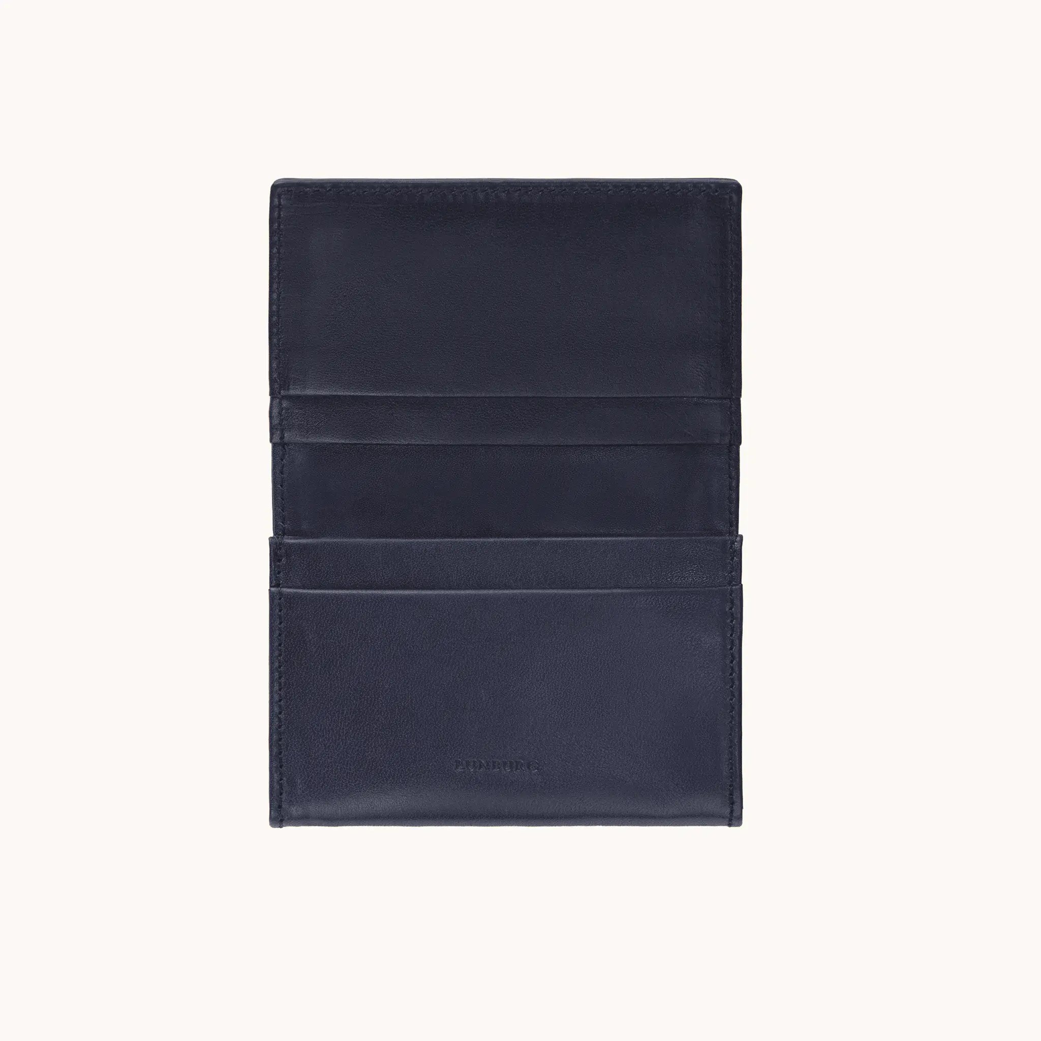 Lunburg Signet Business Card Wallet in Nocturnal Sapphire, open interior view showing card pockets on the upper flap with the heat-embossed Lunburg mark and card slots on the lower panel, in vegetable-tanned Perpetual Leather (from Tempesti) with folded edge construction throughout.