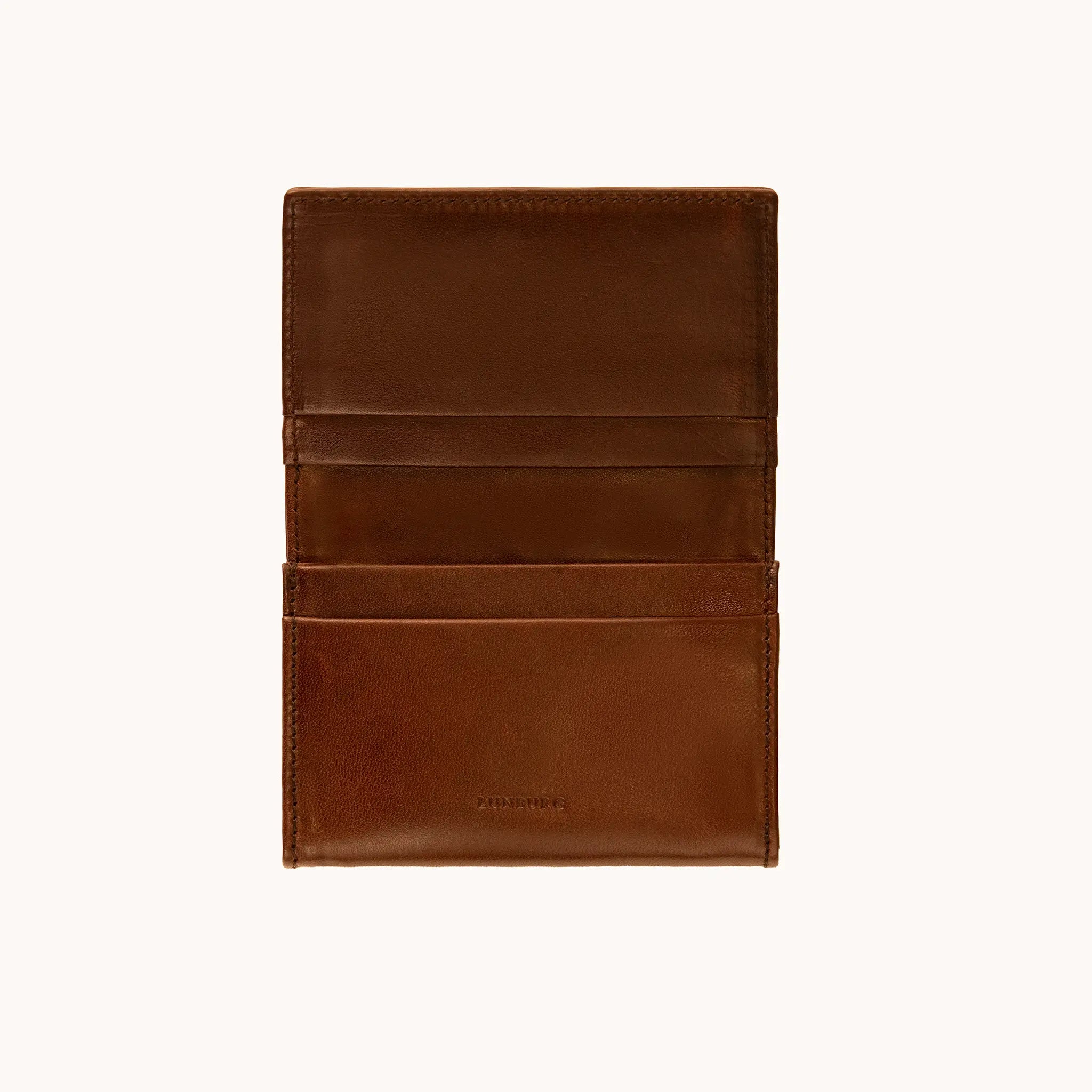 Lunburg Signet Business Card Wallet in Deep Mahogany, open interior view showing card pockets on the upper flap with the heat-embossed Lunburg mark and card slots on the lower panel, in vegetable-tanned Perpetual Leather (from Tempesti) with folded edge construction throughout.