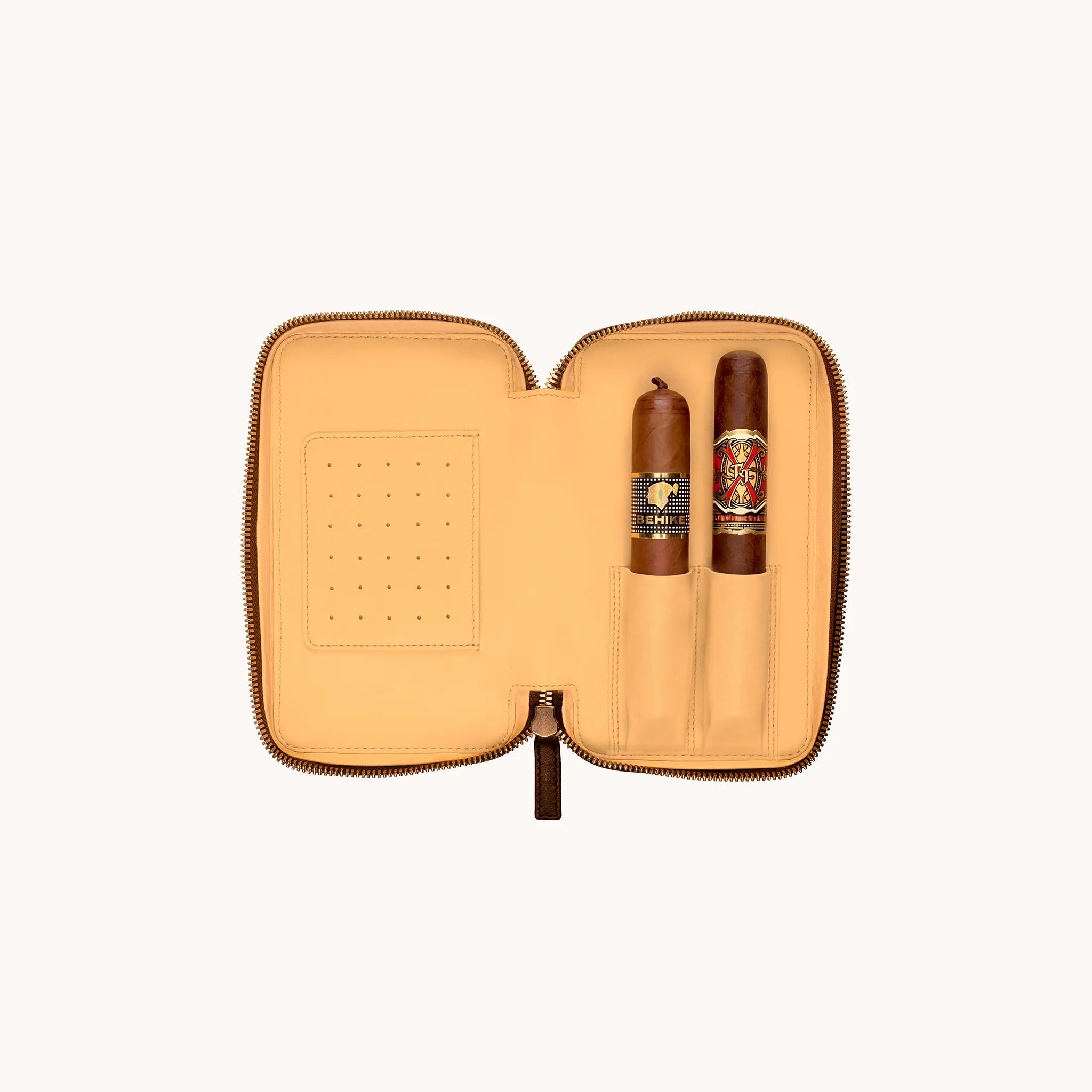 Lunburg Double Cigar Case Curator in Deep Mahogany, interior styled with two cigars seated in goat leather lining sleeves, perforated humidification panel at left, demonstrating the case's capacity for two full-size cigars.