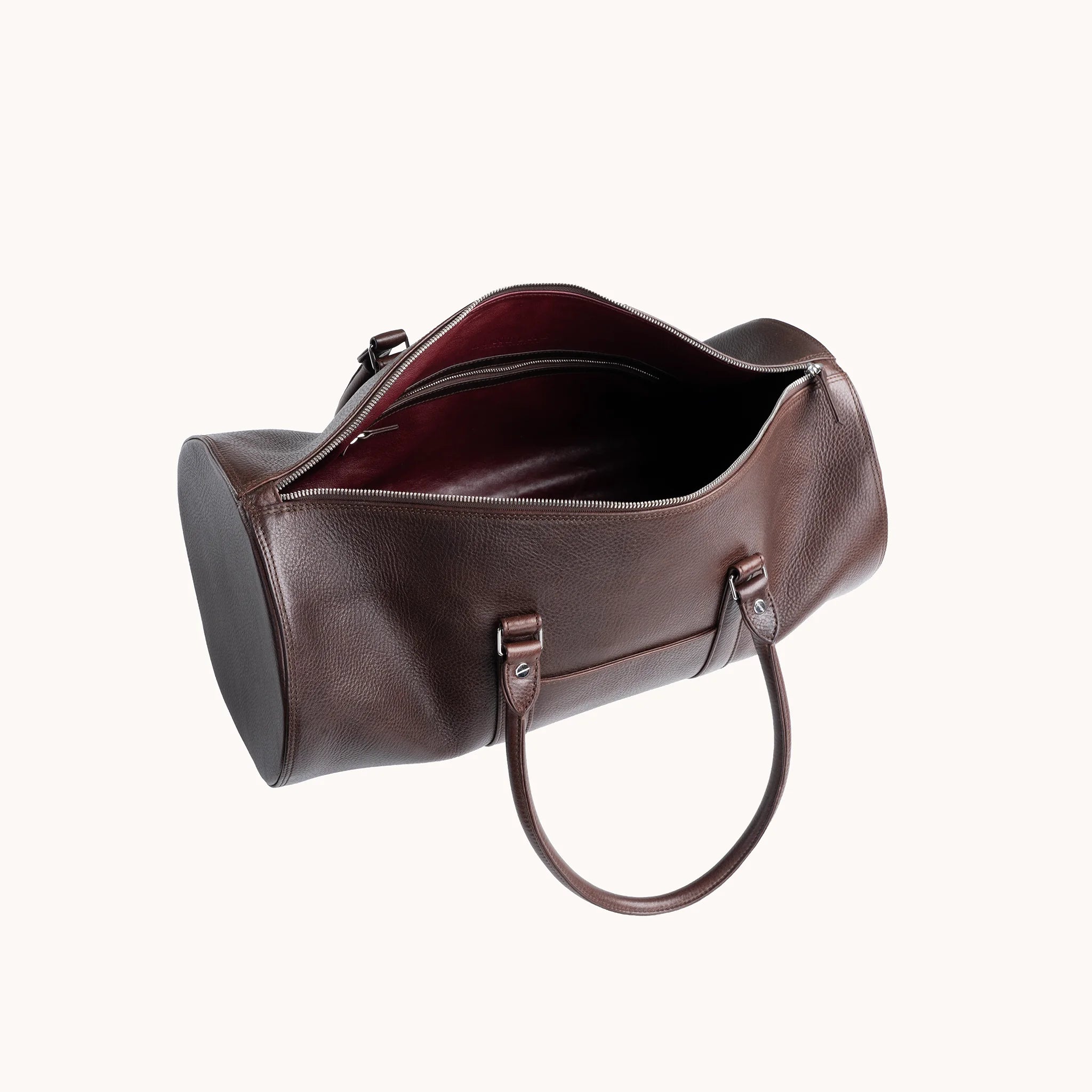 Estate Club Bag interior in Deep Mahogany, goat leather lining and a single main compartment for weekend essentials.