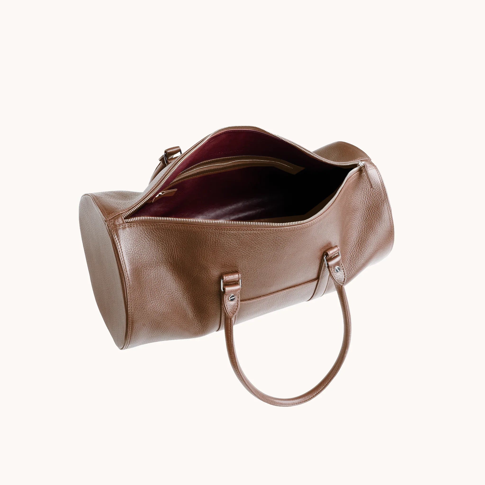 Estate Club Bag interior in Heritage Amber, goat leather lining and a single main compartment for weekend essentials.