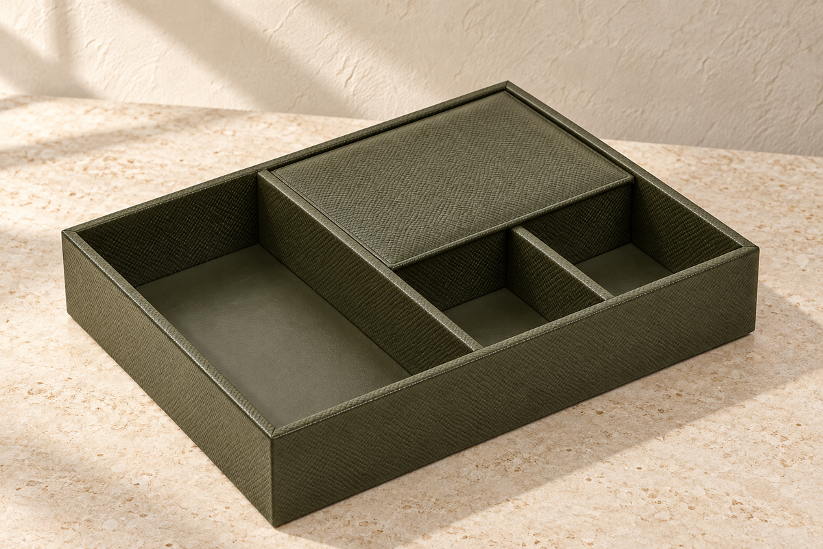 Illustrative covered-compartment valet tray, view 1: rectangular straight-walled tray with one long left bay, two small right-front bays and a closed right-rear lid.