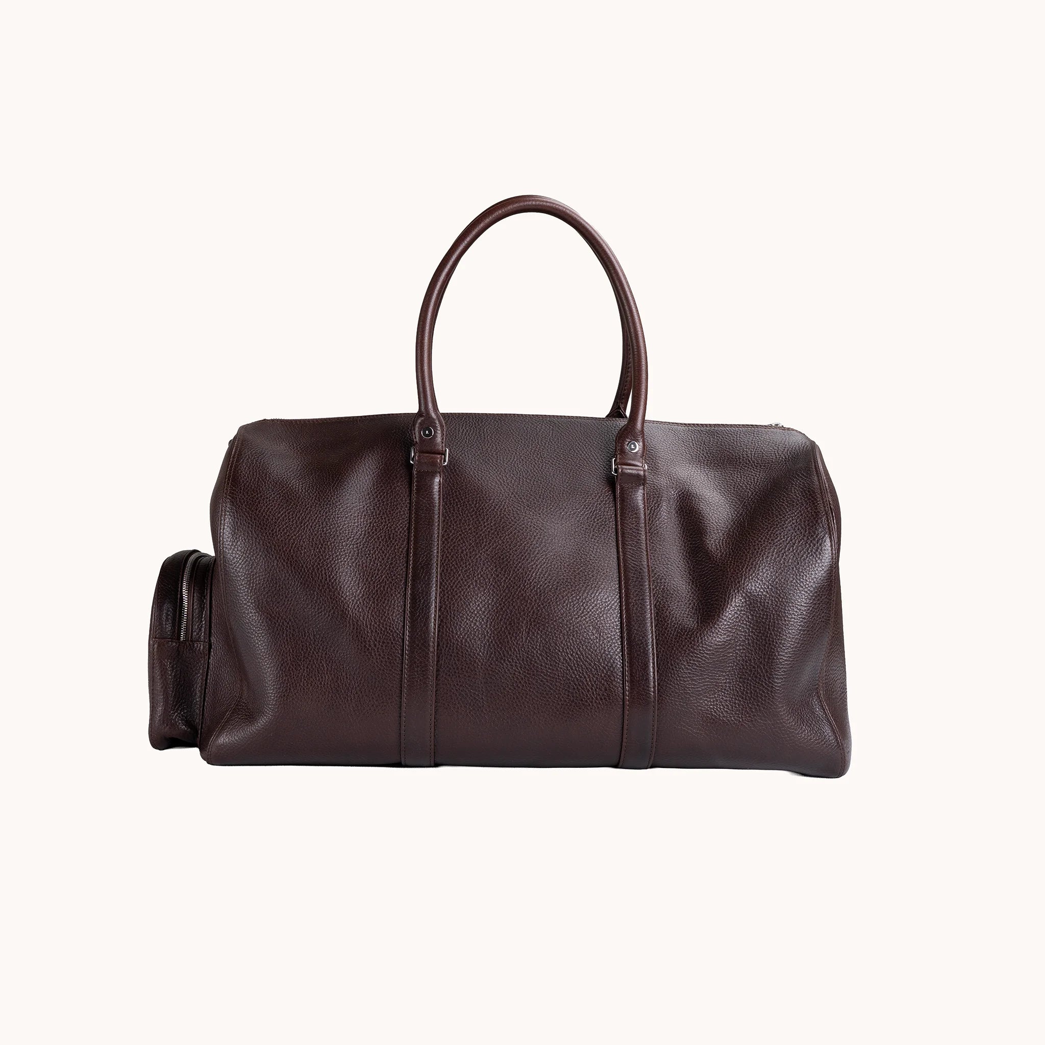 Lunburg Estate Duffle Bag in tumbled Deep Mahogany leather, back view of the clean panelled body.