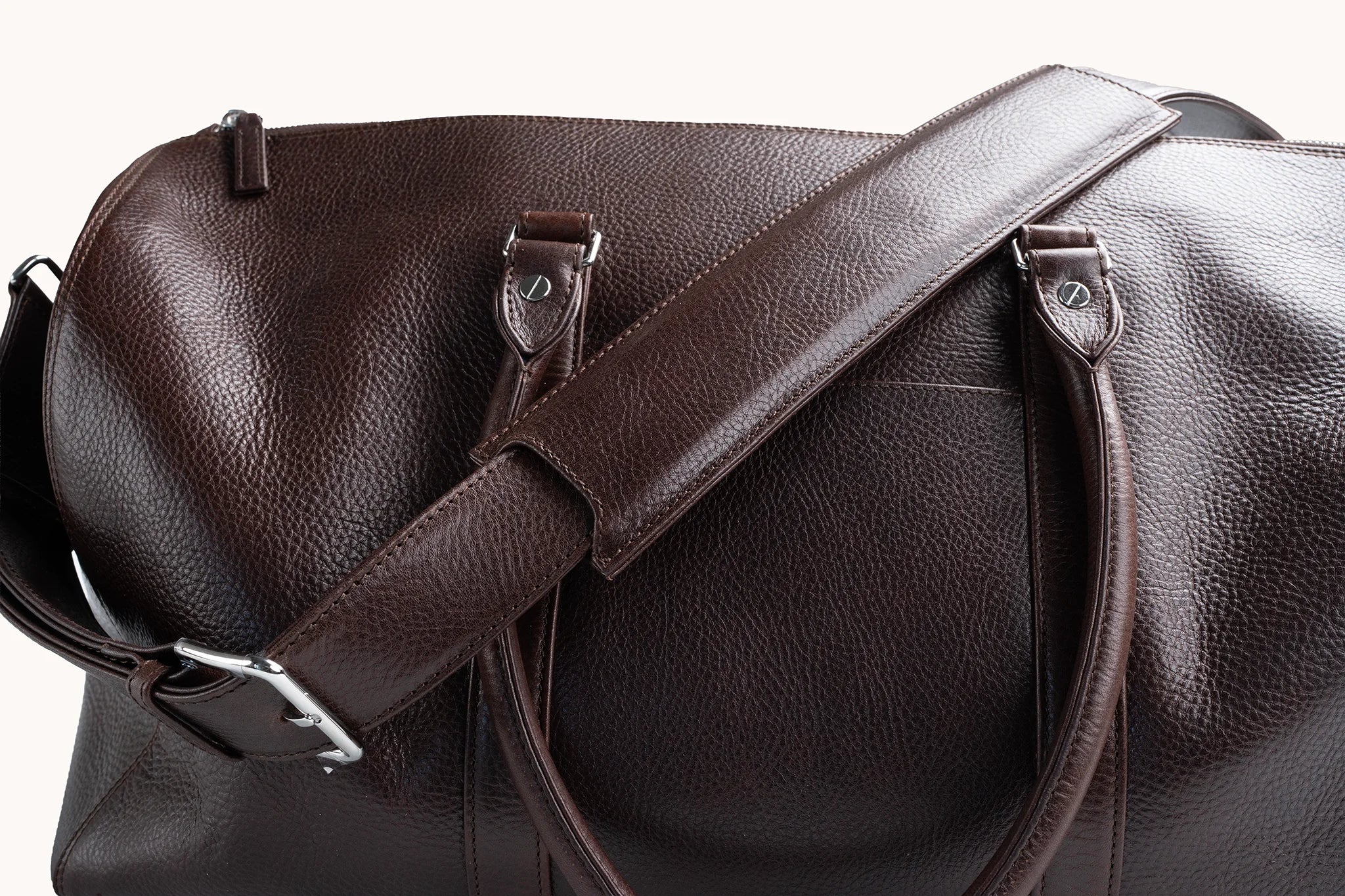 Estate Duffle Bag in Deep Mahogany, twin top handles paired with the removable shoulder strap.
