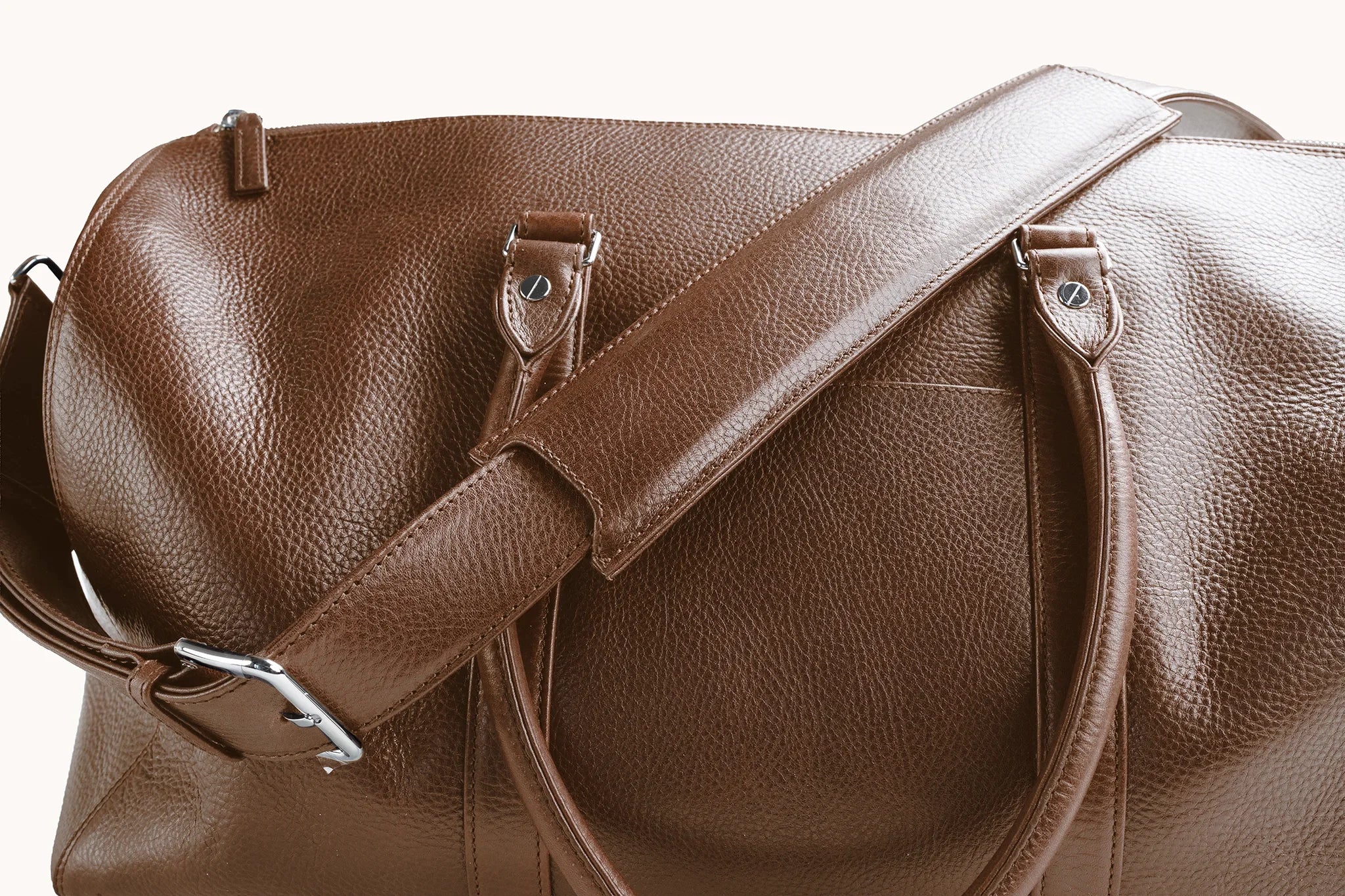Estate Duffle Bag in Heritage Amber, twin top handles paired with the removable shoulder strap.