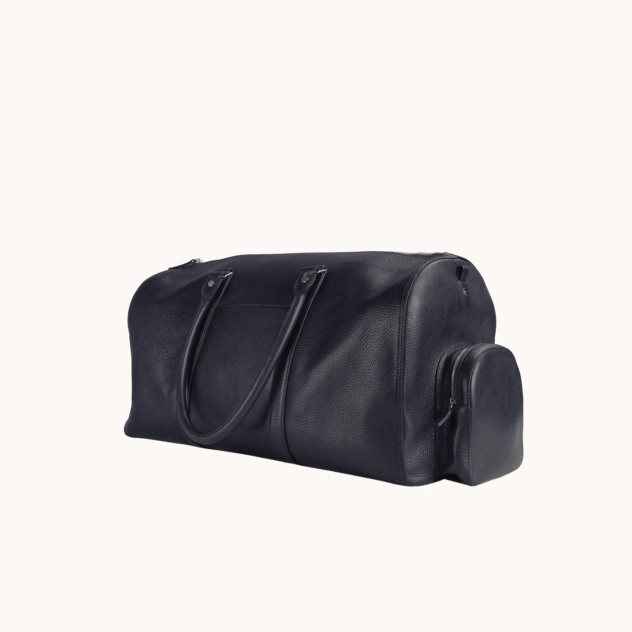 Lunburg Estate Duffle Bag in tumbled Nocturnal Sapphire leather, three-quarter view showing depth and handle drop.