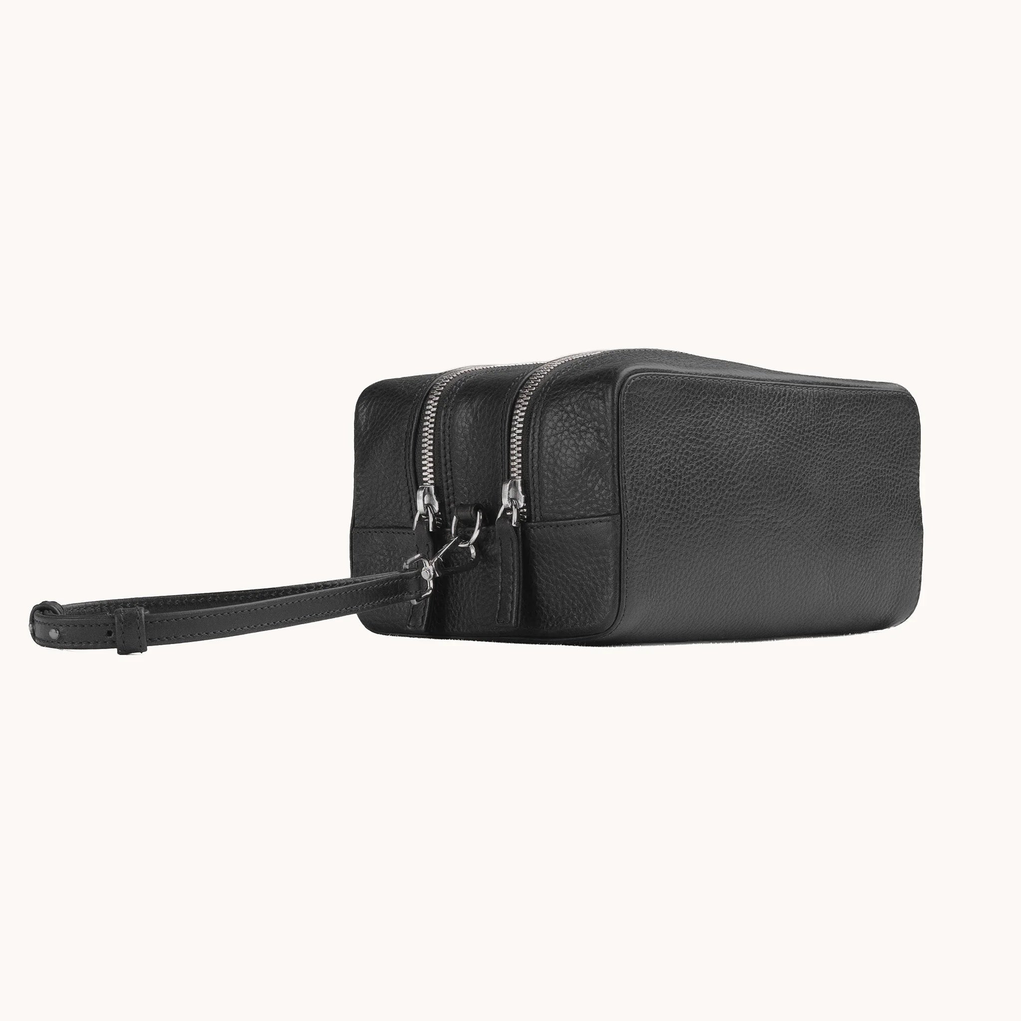 Lunburg Chamberlain Grand Toiletry Bag in tumbled Burnt Timber leather, three-quarter view showing depth and zip line.