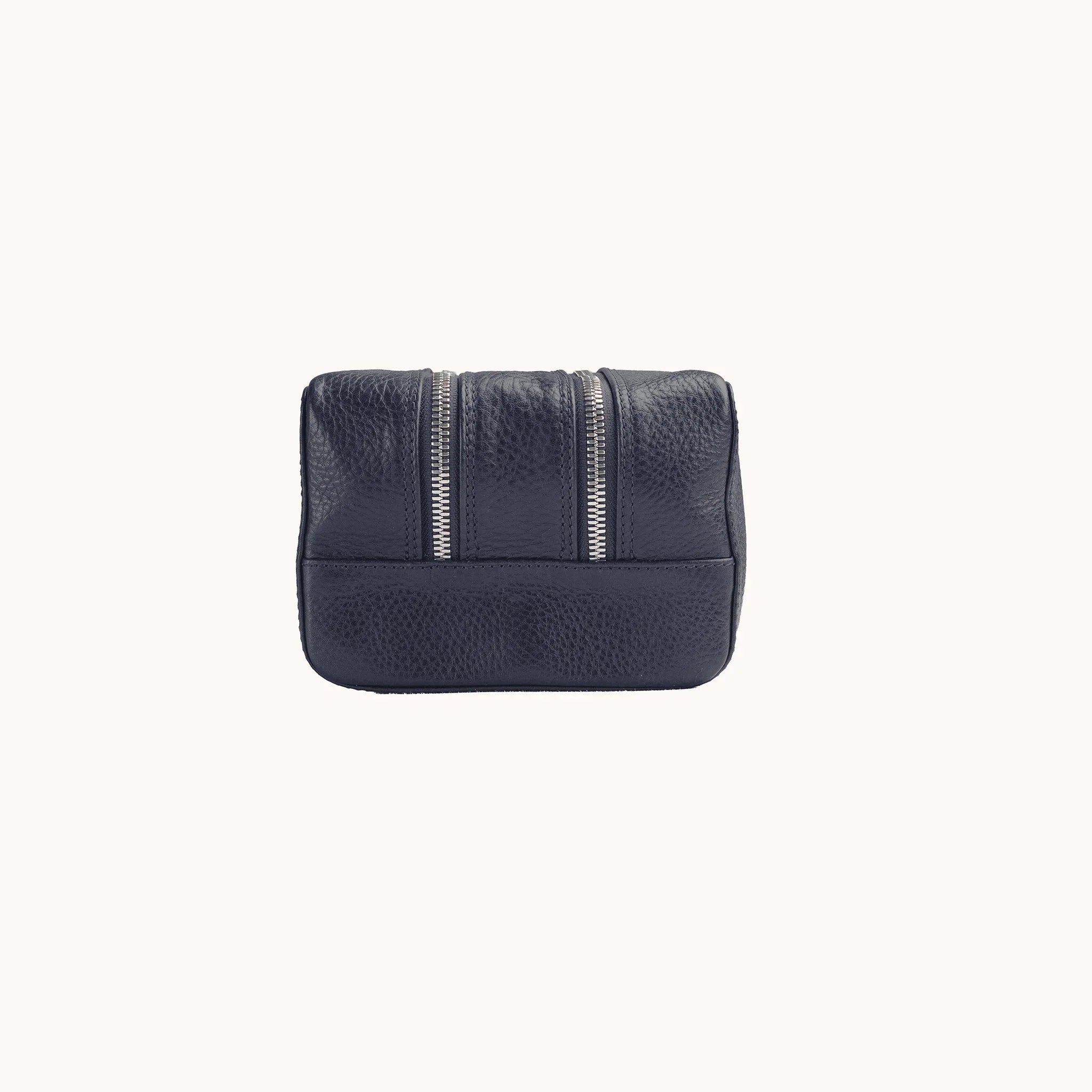 Lunburg Chamberlain Grand Toiletry Bag in tumbled Nocturnal Sapphire leather, opposite side profile with seam and base.
