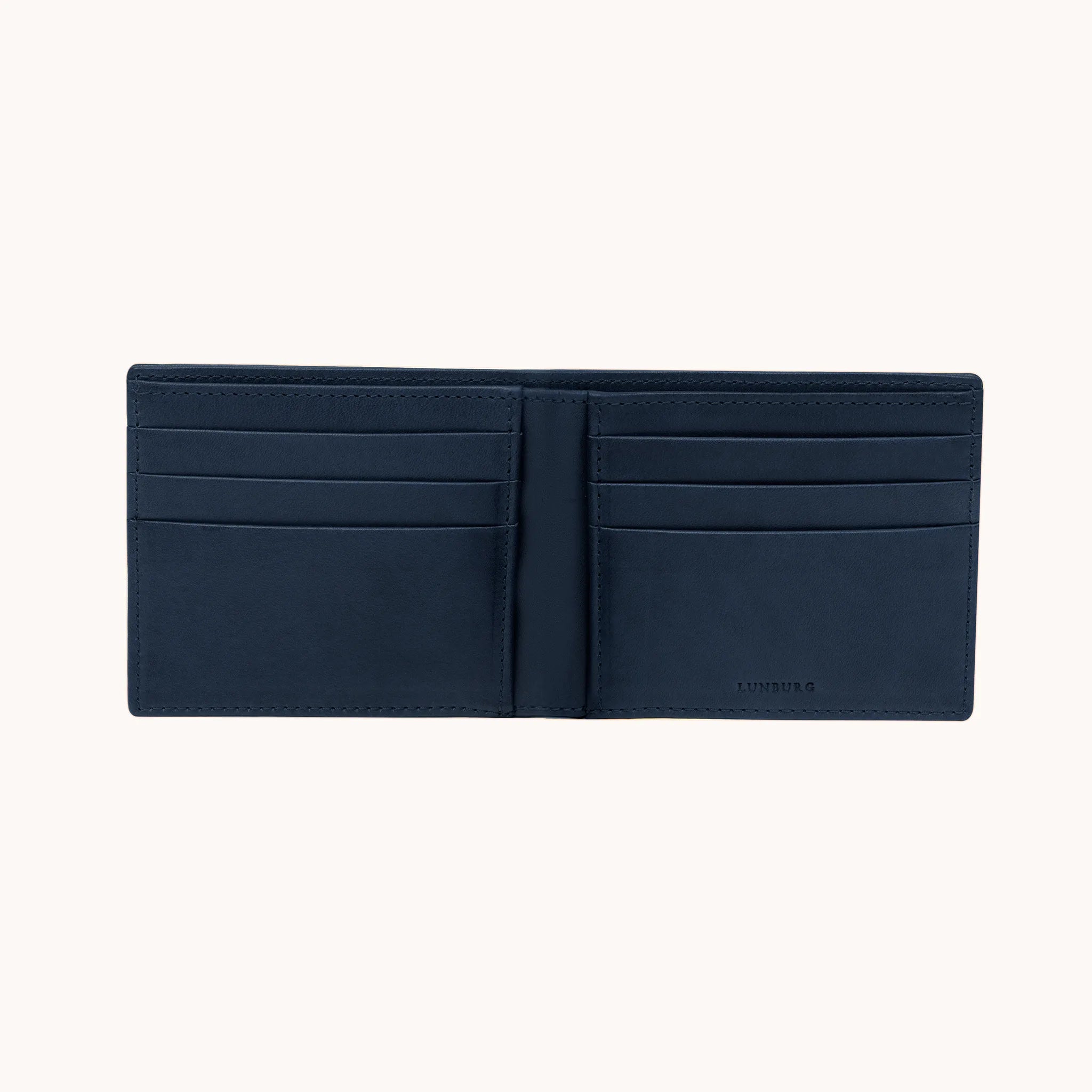 Lunburg Signet Horizontal Bifold in Nocturnal Sapphire, fully open interior view showing card slots on both panels and the heat-embossed Lunburg mark on the lower right, in vegetable-tanned Perpetual Leather (from Tempesti) with folded edge construction throughout.