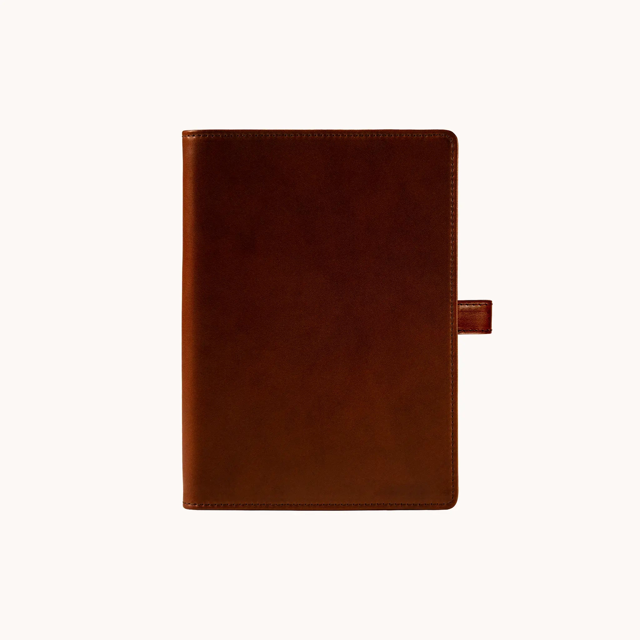Lunburg Memoir Notebook Cover with Pen Loop in Deep Mahogany, front view closed, showing the clean face and leather pen loop on the right edge, in vegetable-tanned Perpetual Leather (from Tempesti) with folded edge construction