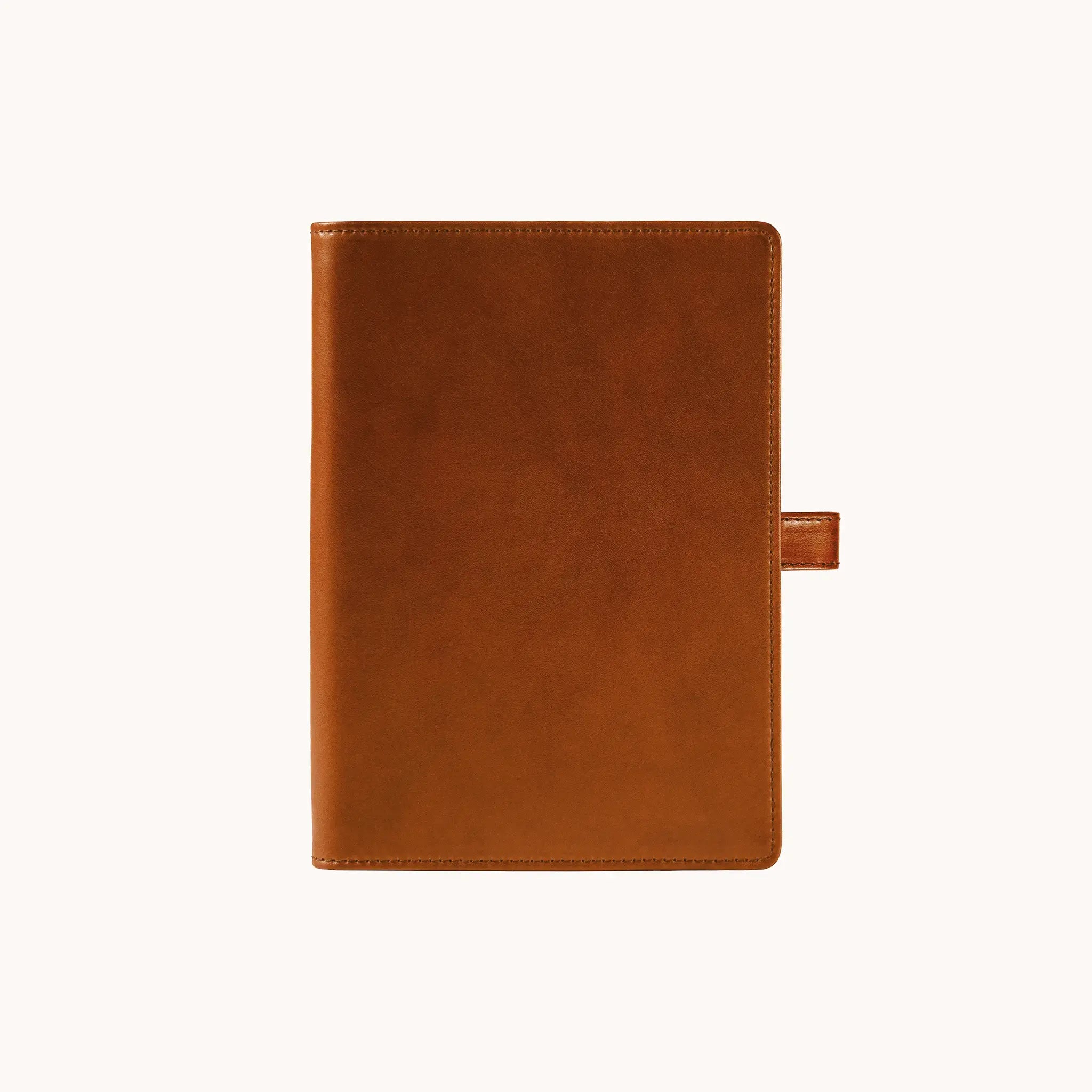 Lunburg Memoir Notebook Cover with Pen Loop in Heritage Amber, front view closed, showing the clean face and leather pen loop on the right edge, in vegetable-tanned Perpetual Leather (from Tempesti) with folded edge construction.