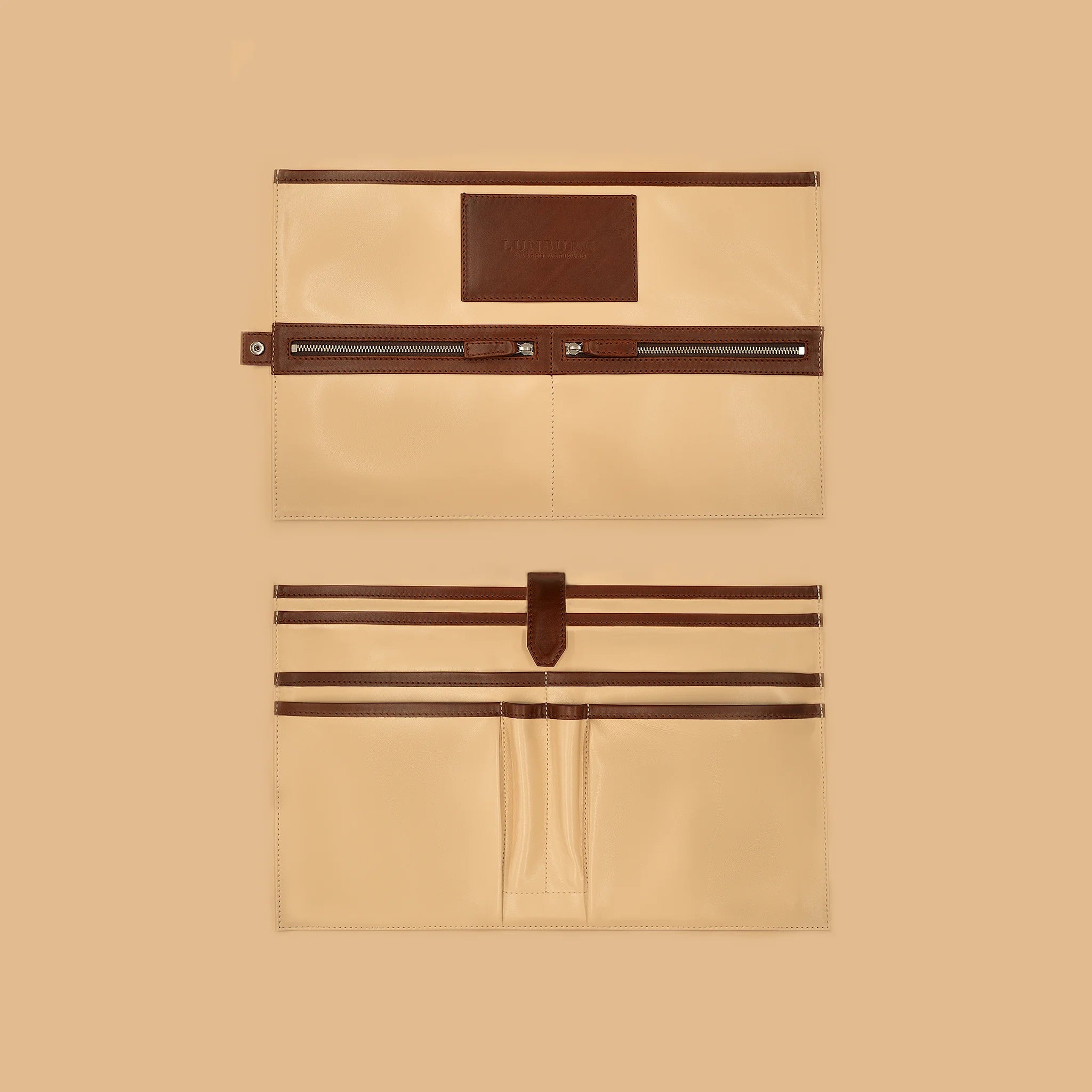 Lunburg Opus Briefcase Integral interior vertical layout in Deep Mahogany, high-contrast goat leather lining with heat-embossed Lunburg card holder, two pen holders, dedicated compartments for laptop, tablet, and documents, two zipped pockets for secure storage, and four large open pockets for accessories, with Deep Mahogany Perpetual Leather (from Tempesti) trim and 316L stainless steel hardware.