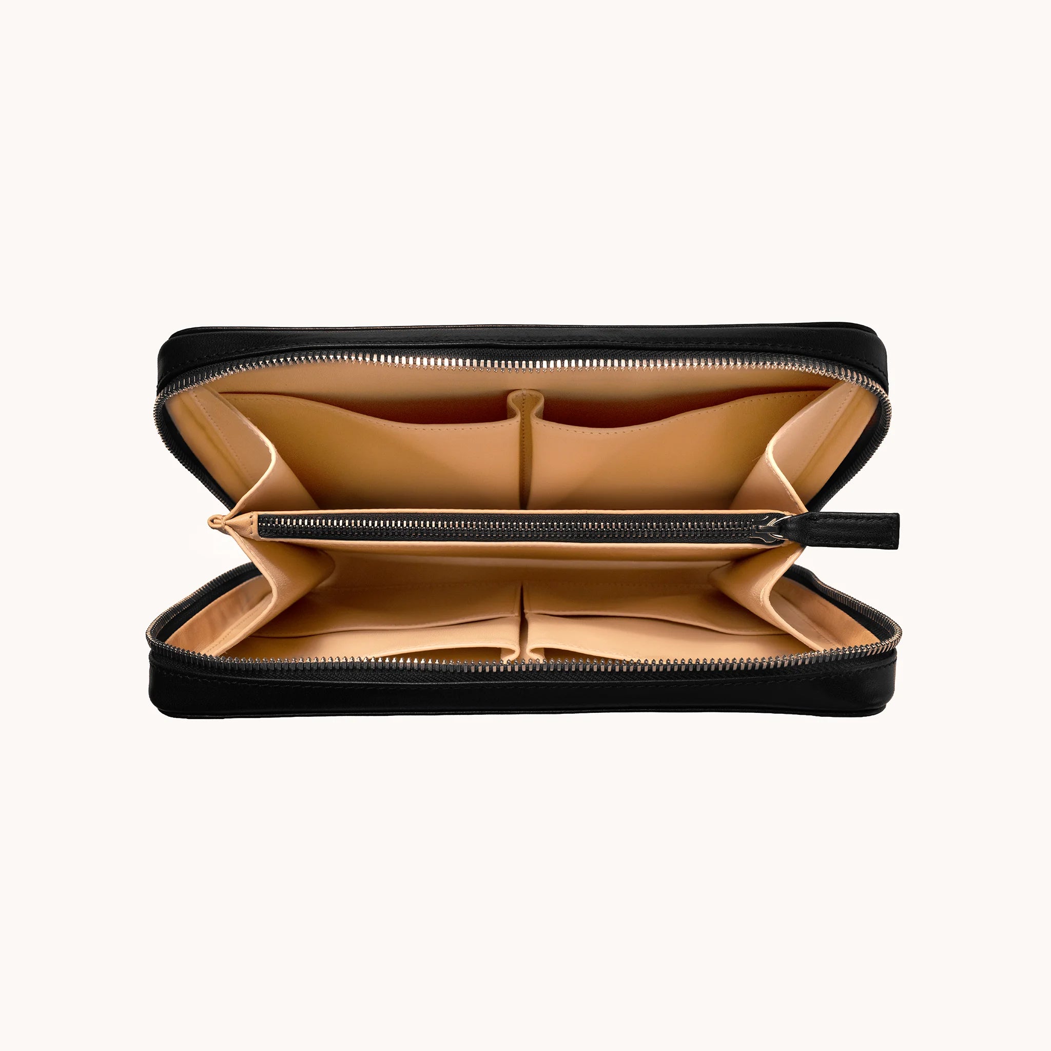 Lunburg Memoir Organiser in Burnt Timber, open interior view showing the goat leather lining with multiple compartments, an internal YKK Excella zipped pocket, and open pockets for cables and accessories, in vegetable-tanned Perpetual Leather (from Tempesti) with folded edge construction throughout.