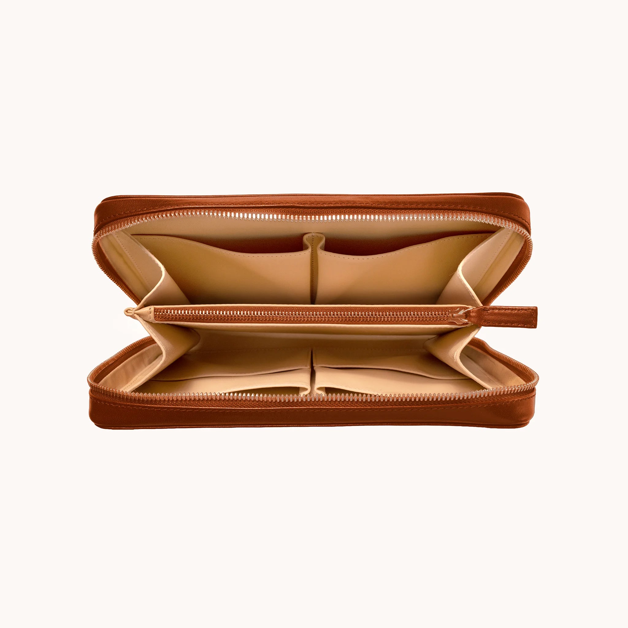 Lunburg Memoir Organiser in Heritage Amber, open interior view showing the goat leather lining with multiple compartments, an internal YKK Excella zipped pocket, and open pockets for cables and accessories, in vegetable-tanned Perpetual Leather (from Tempesti) with folded edge construction throughout