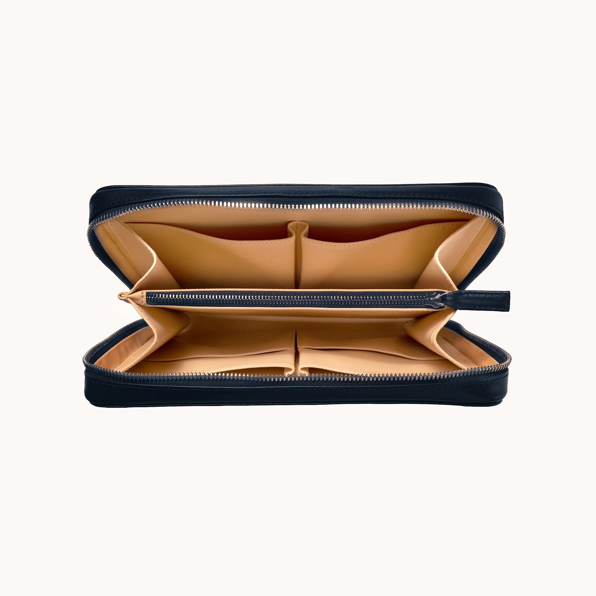 Lunburg Memoir Organiser in Nocturnal Sapphire, open interior view showing the goat leather lining with multiple compartments, an internal YKK Excella zipped pocket, and open pockets for cables and accessories, in vegetable-tanned Perpetual Leather (from Tempesti) with folded edge construction throughout