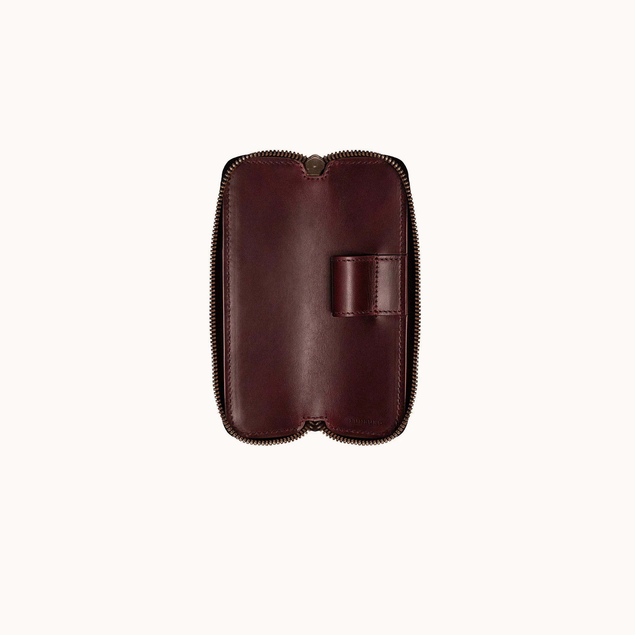 Lunburg Single Pen Case Curator in Deep Mahogany, interior view with case fully open, single leather pen loop centred on the goat leather lining, heat-embossed Lunburg mark visible at lower edge, YKK Excella zipper framing the perimeter.