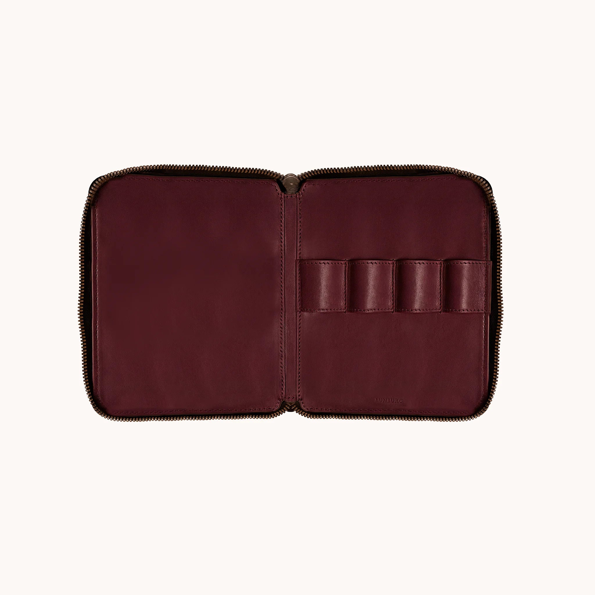 Lunburg Quad Pen Case Curator, interior view with case fully open, four leather pen loops across the right panel on the goat leather lining, large open document panel on the left, heat-embossed Lunburg mark visible at lower edge, YKK Excella zipper framing the perimeter.