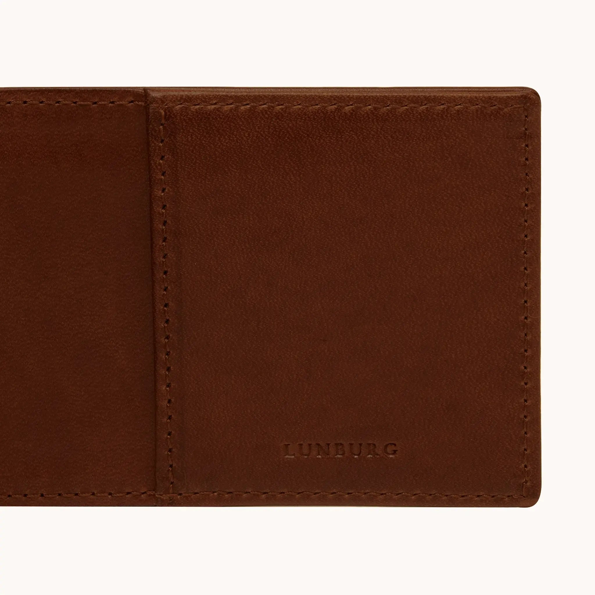 Lunburg Signet Small Horizontal in Deep Mahogany, detail view of the interior right panel showing the heat-embossed Lunburg mark beside the card slot partition, in vegetable-tanned Perpetual Leather (from Tempesti) with folded edge construction throughout.