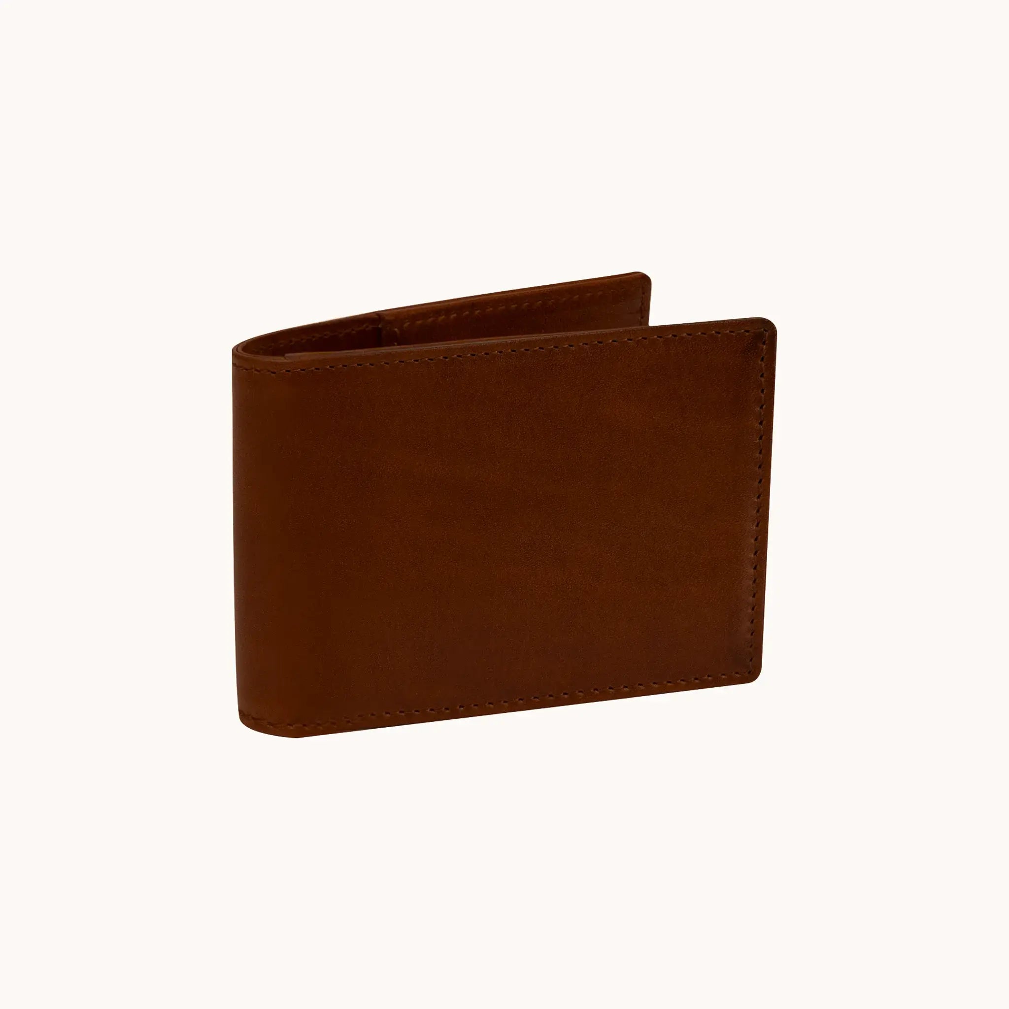Lunburg Signet Small Horizontal in Deep Mahogany, three-quarter view slightly open showing the exterior grain, spine, and a glimpse of the interior, in vegetable-tanned Perpetual Leather (from Tempesti) with folded edge construction.
