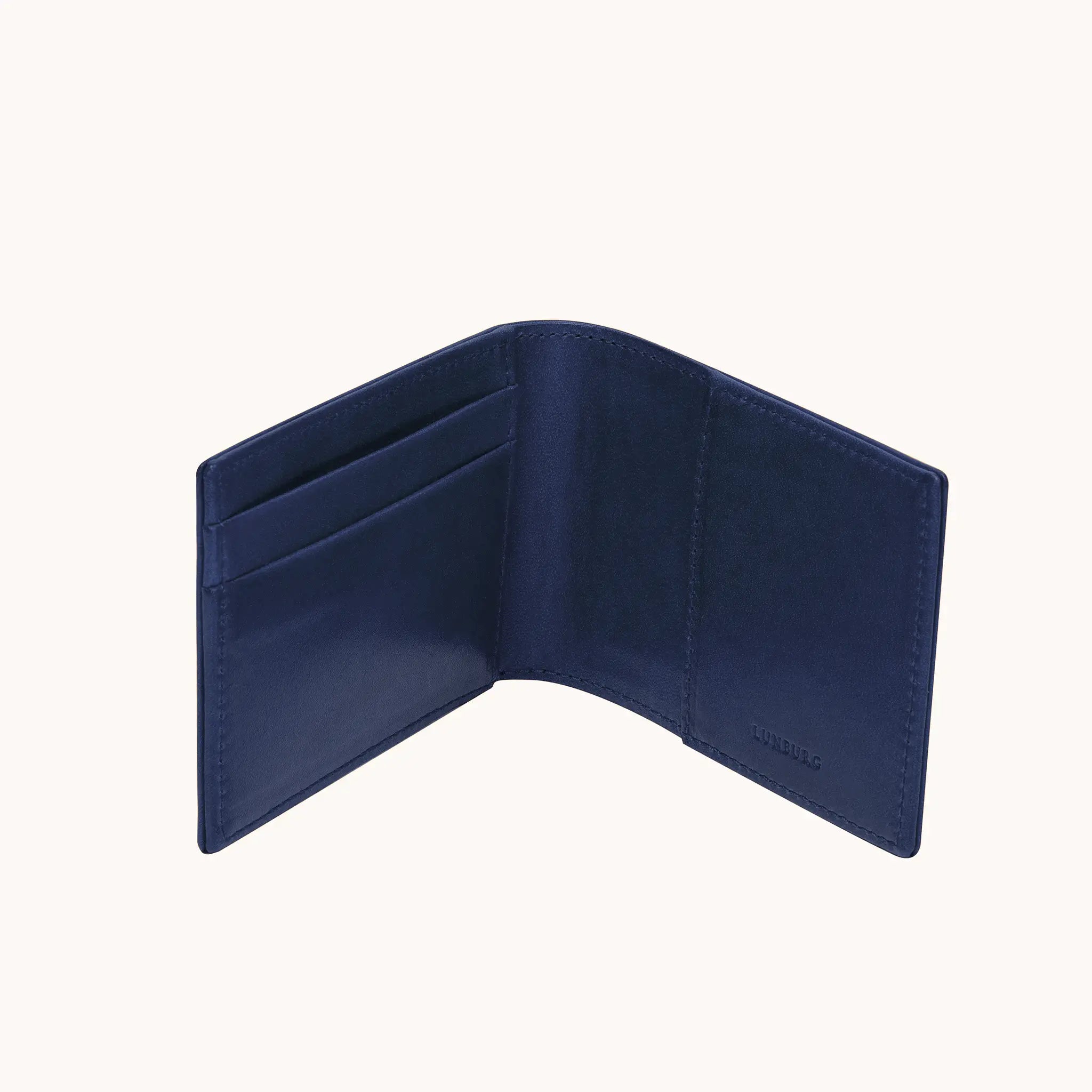 Lunburg Signet Small Horizontal in Nocturnal Sapphire, open interior view showing card slots on the left panel, a large open pocket on the right panel, and the heat-embossed Lunburg mark on the lower right, in vegetable-tanned Perpetual Leather (from Tempesti) with folded edge construction throughout.