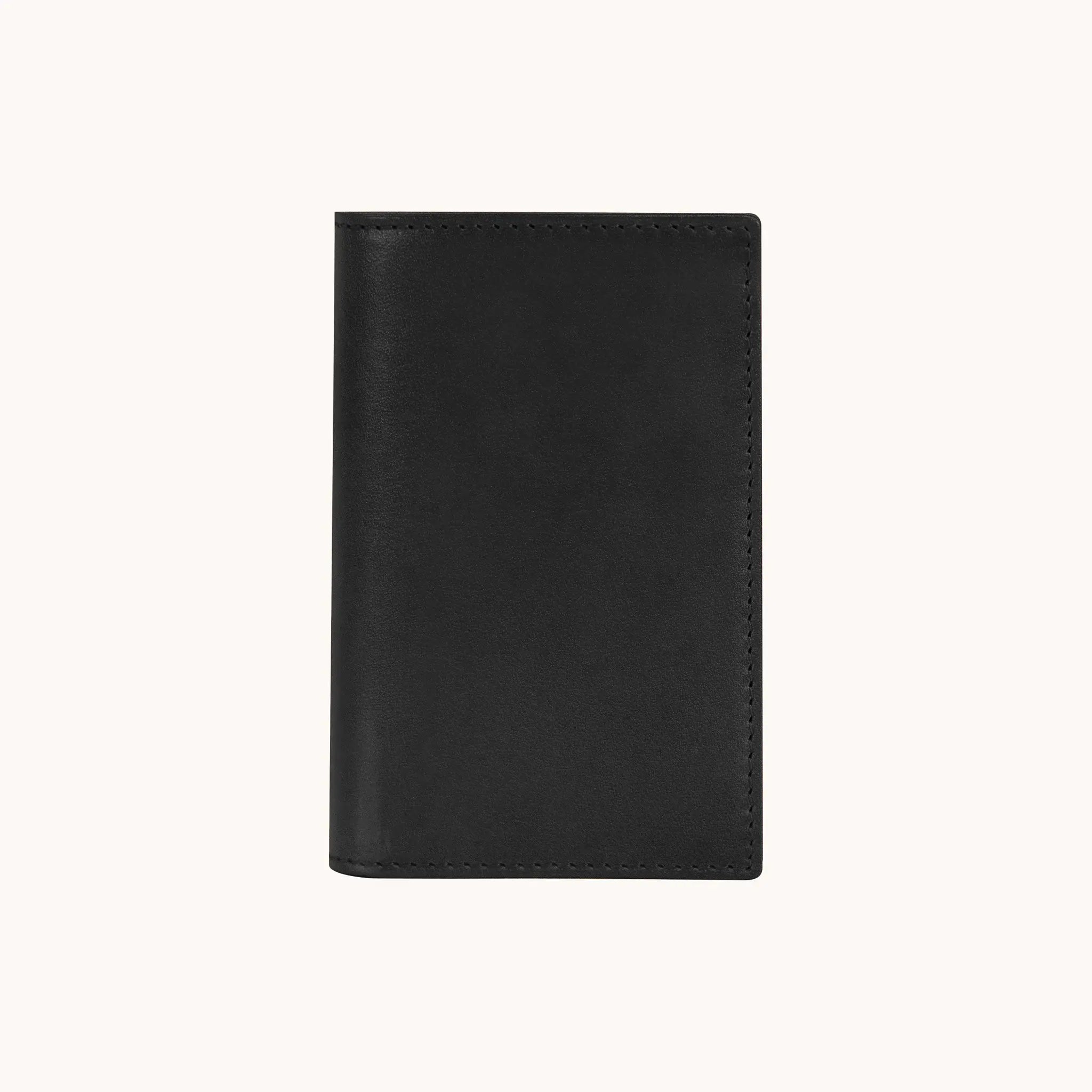 Lunburg Signet Small Vertical in Burnt Timber, front view closed, showing the clean face of vegetable-tanned Perpetual Leather (from Tempesti) with folded edge construction and no visible raw edges.