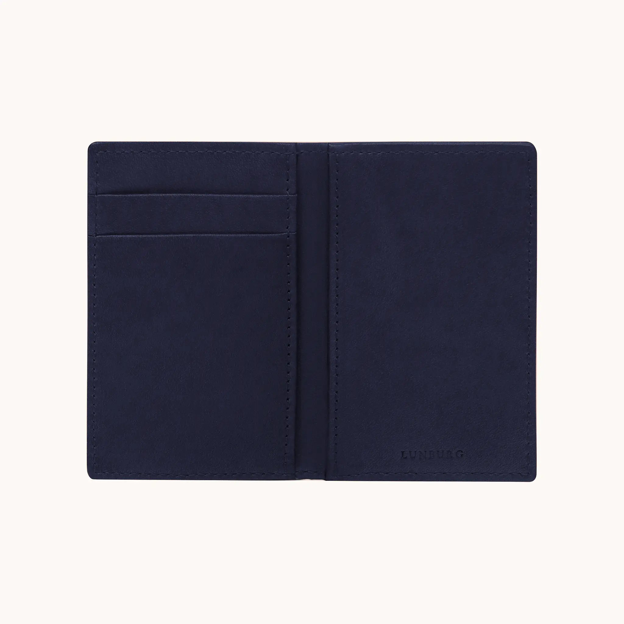 Lunburg Signet Small Vertical in Nocturnal Sapphire, fully open interior view showing card slots on the left panel, a large open pocket on the right panel, and the heat-embossed Lunburg mark on the lower right, in vegetable-tanned Perpetual Leather (from Tempesti) with folded edge construction throughout.