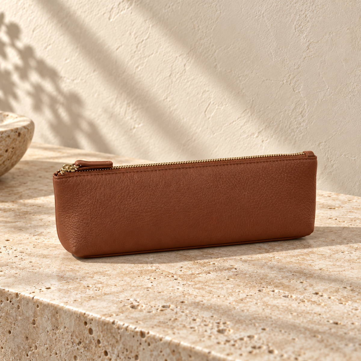 Illustrative standing zip pencil pouch — alternate angle shows the long side and single top zip with pull.