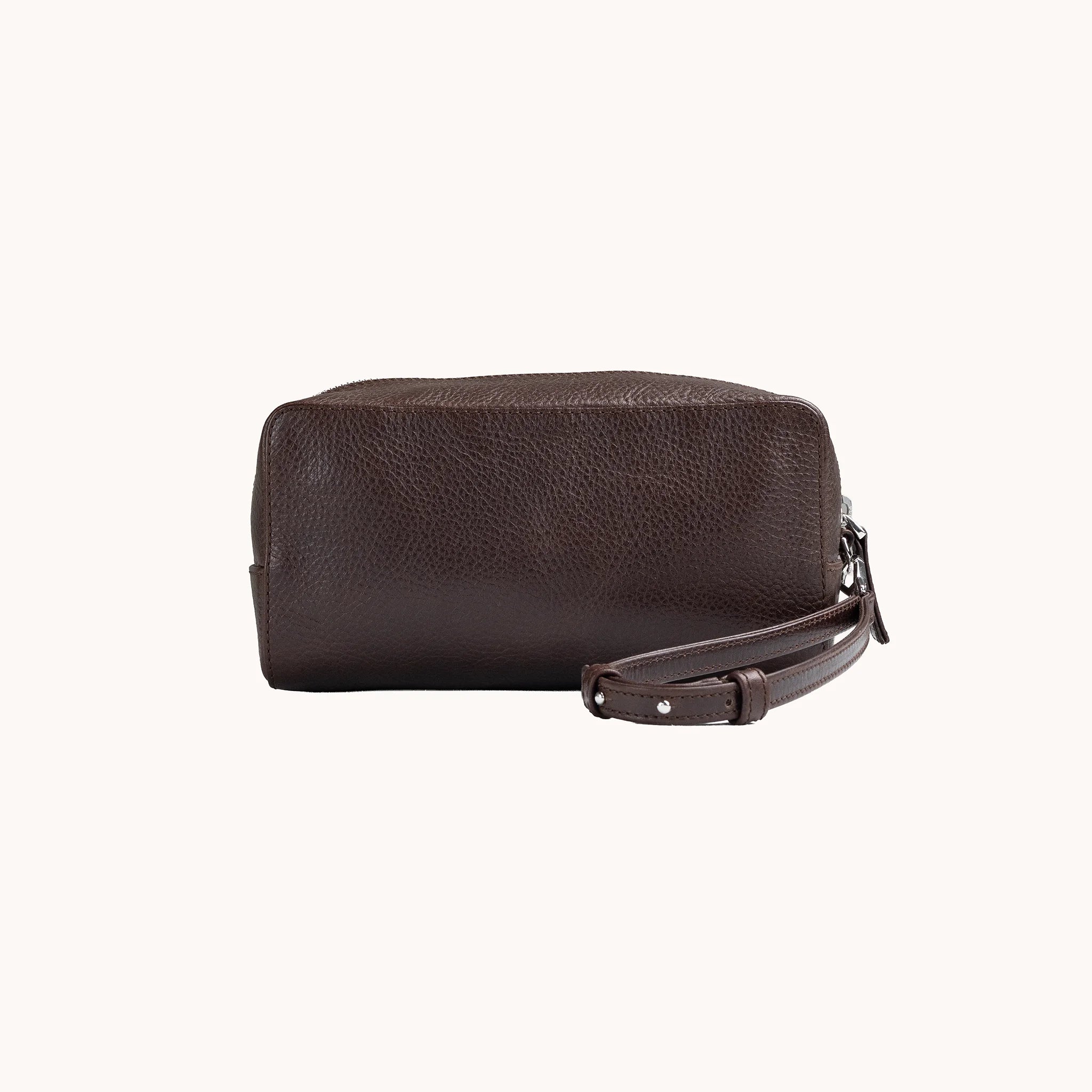 Lunburg Chamberlain Toiletry Bag in tumbled Deep Mahogany leather, front view of the compact travel case.