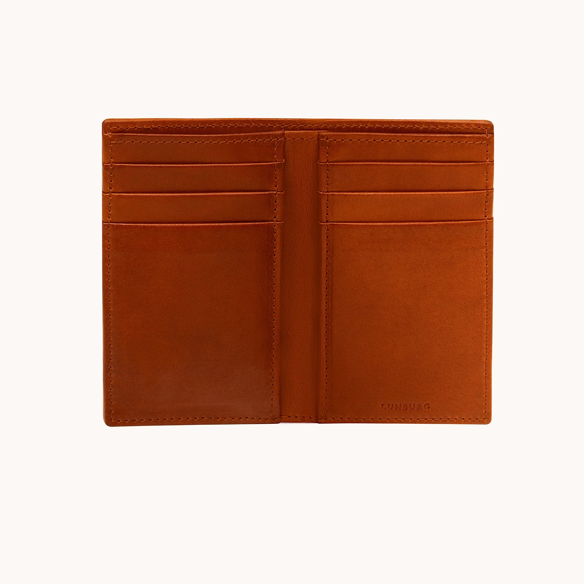 Lunburg Vertical Bifold Wallet in Heritage Amber fully opened, displaying six card slots across both panels and two hidden compartments, folded edge construction, and heat-embossed Lunburg mark on lower right, in vegetable-tanned Perpetual Leather.