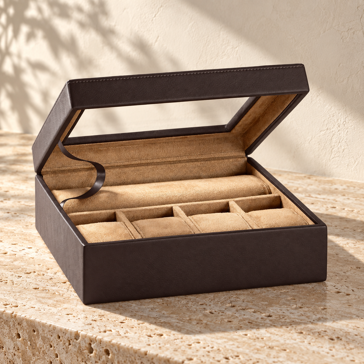 Illustrative window-lid collector case, view 2: open hinged lid with a dark support ribbon; pale interior shows a long rear cushion and separated front cushion bays.