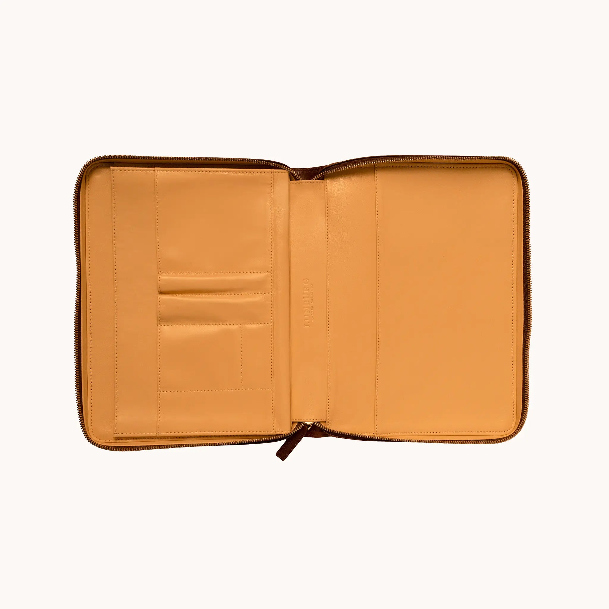 Lunburg Memoir Workstation in Burnt Timber, open interior view showing the goat leather lining with card slots, pen holders, and open pockets on the left panel, a large document compartment on the right panel, and the heat-embossed Lunburg mark at centre, in vegetable-tanned Perpetual Leather (from Tempesti) with folded edge construction throughout.