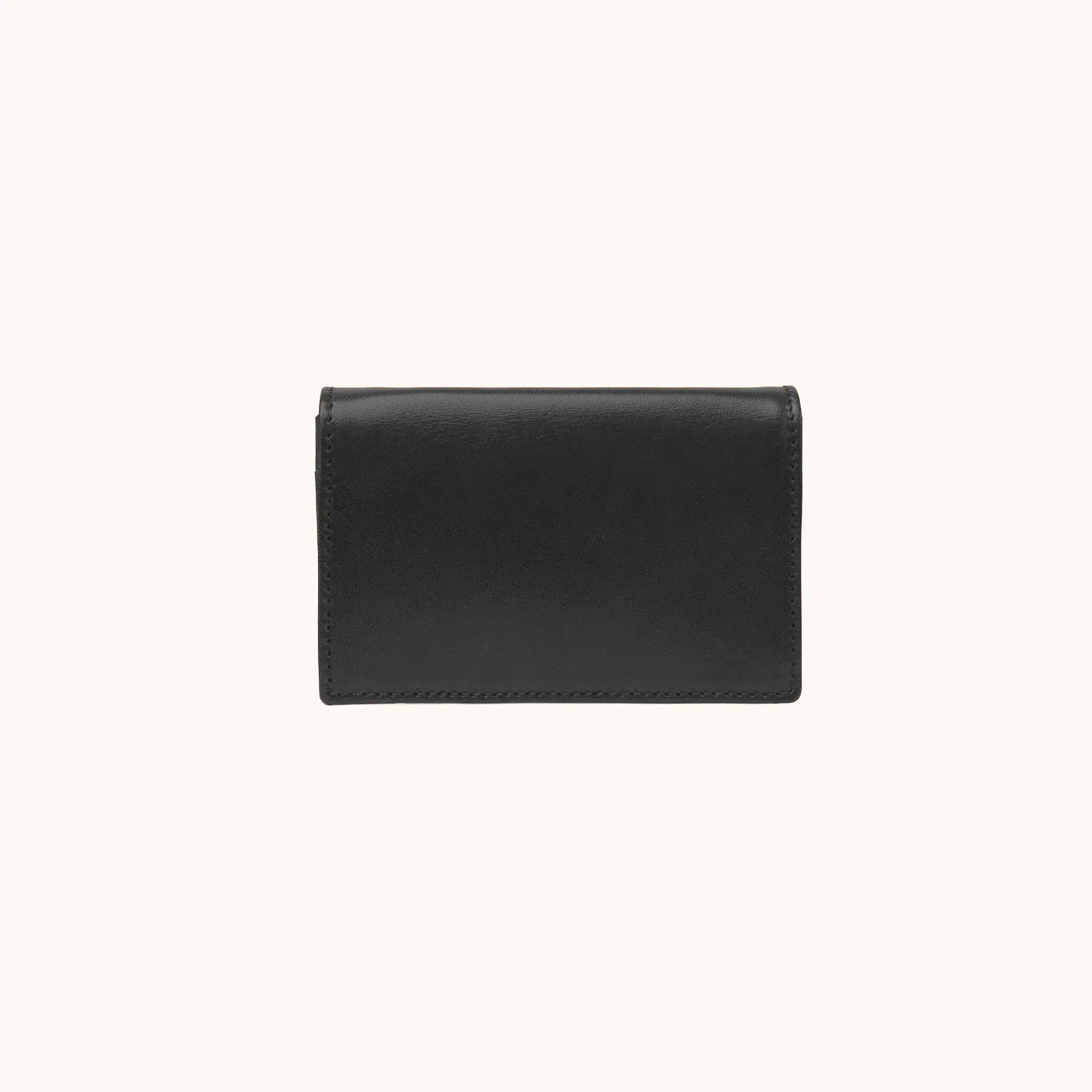 Lunburg Signet Business Card Wallet in Burnt Timber, front view closed, showing the flap closure and clean face of vegetable-tanned Perpetual Leather (from Tempesti) with folded edge construction and no visible raw edges.