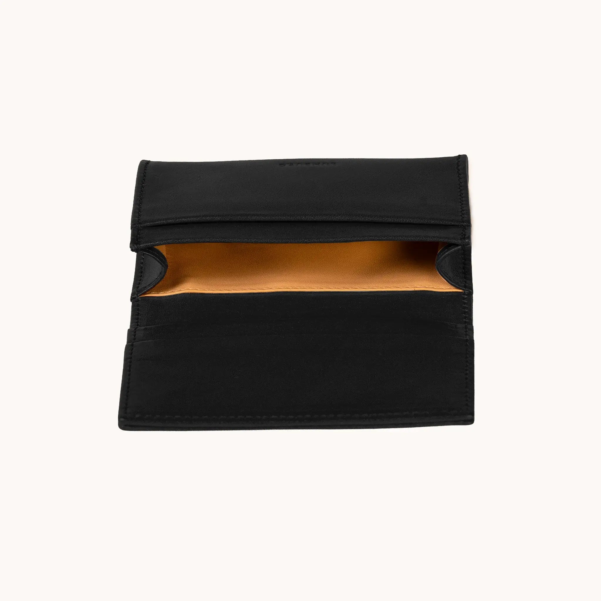 Lunburg Signet Business Card Wallet in Burnt Timber, interior profile view with flap lifted to reveal the goat leather lining of the central compartment and the card slot architecture, in vegetable-tanned Perpetual Leather (from Tempesti) with folded edge construction.