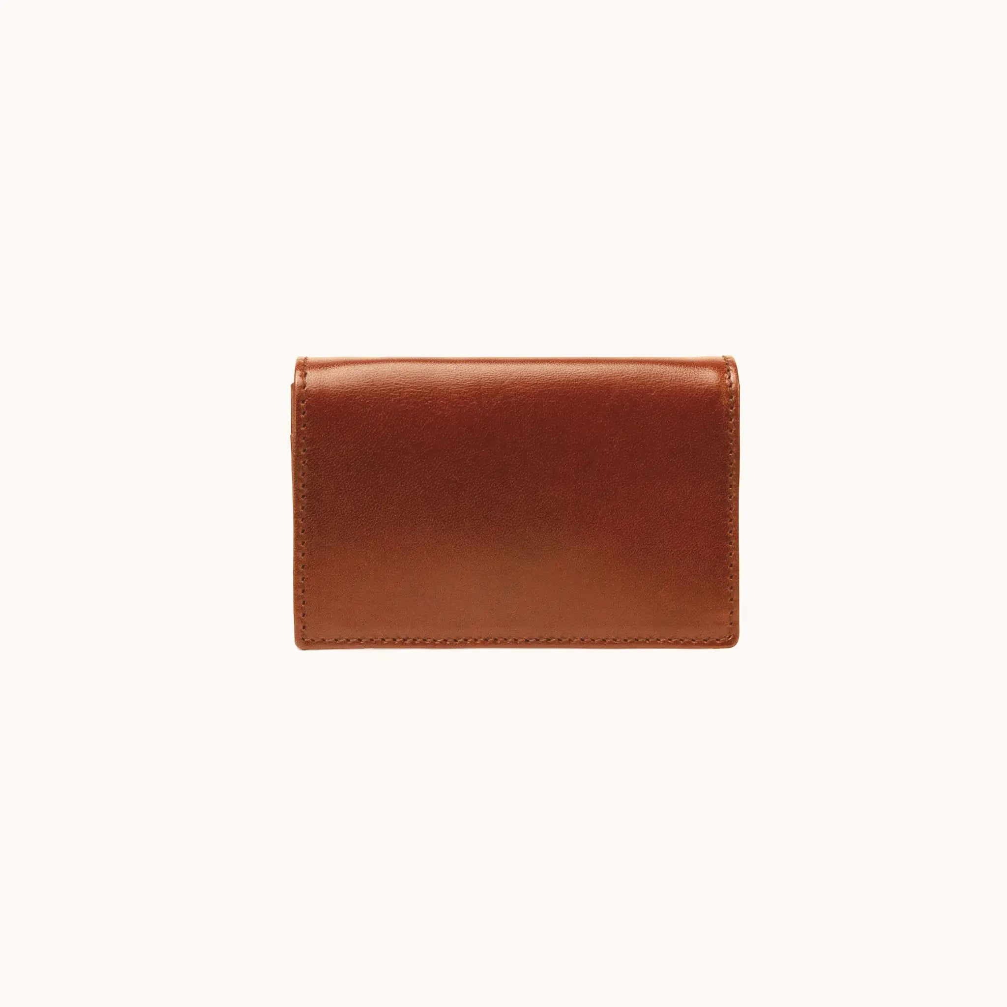 Lunburg Signet Business Card Wallet in Heritage Amber, front view closed, showing the flap closure and clean face of vegetable-tanned Perpetual Leather (from Tempesti) with folded edge construction 