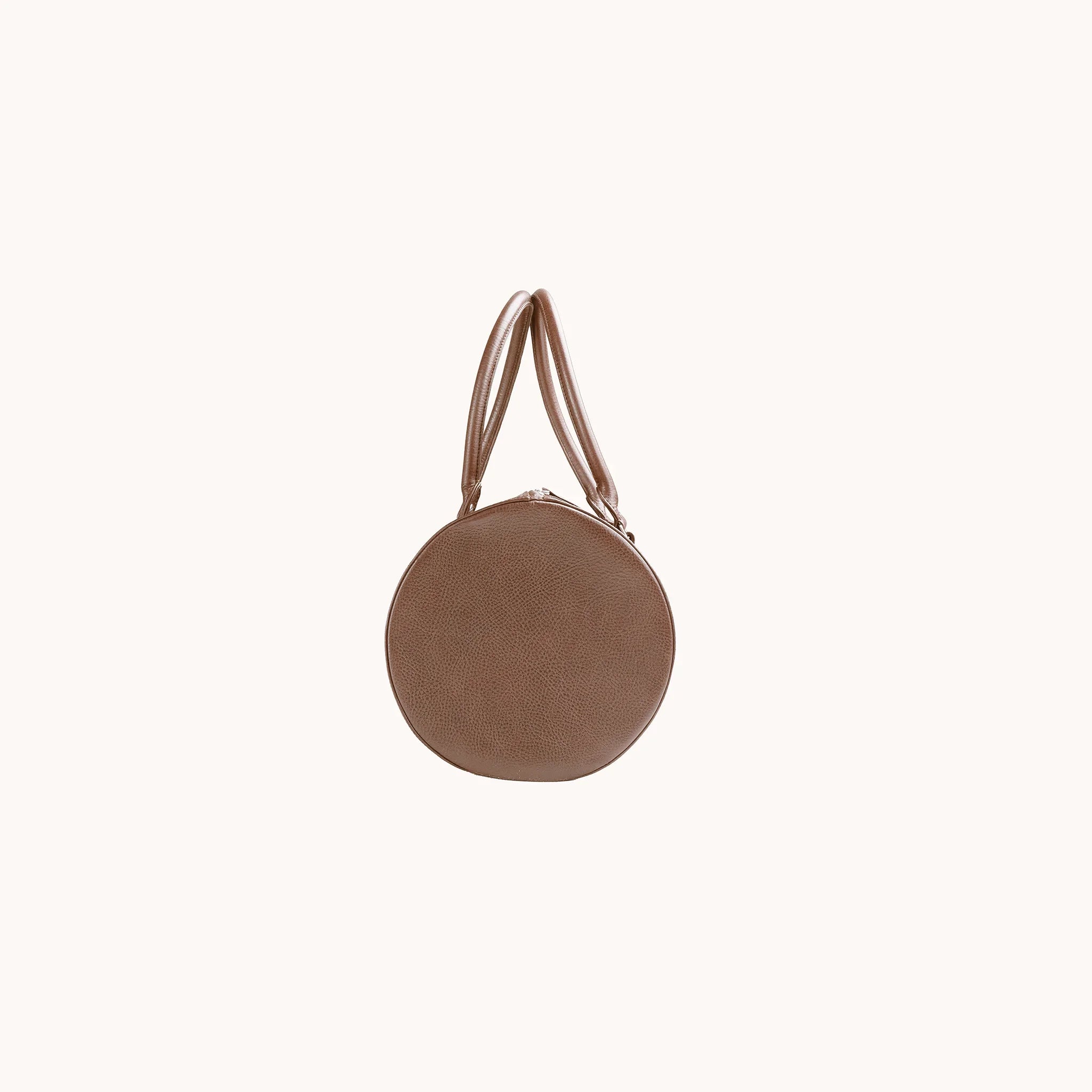 Lunburg Estate Club Bag in tumbled Heritage Amber leather, side profile showing volume and handle attachment.