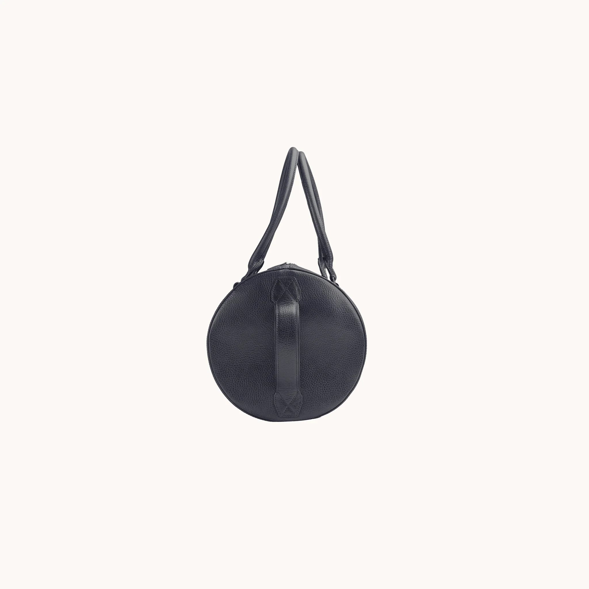 Lunburg Estate Club Bag in tumbled Nocturnal Sapphire leather, opposite side profile with side seam and base.