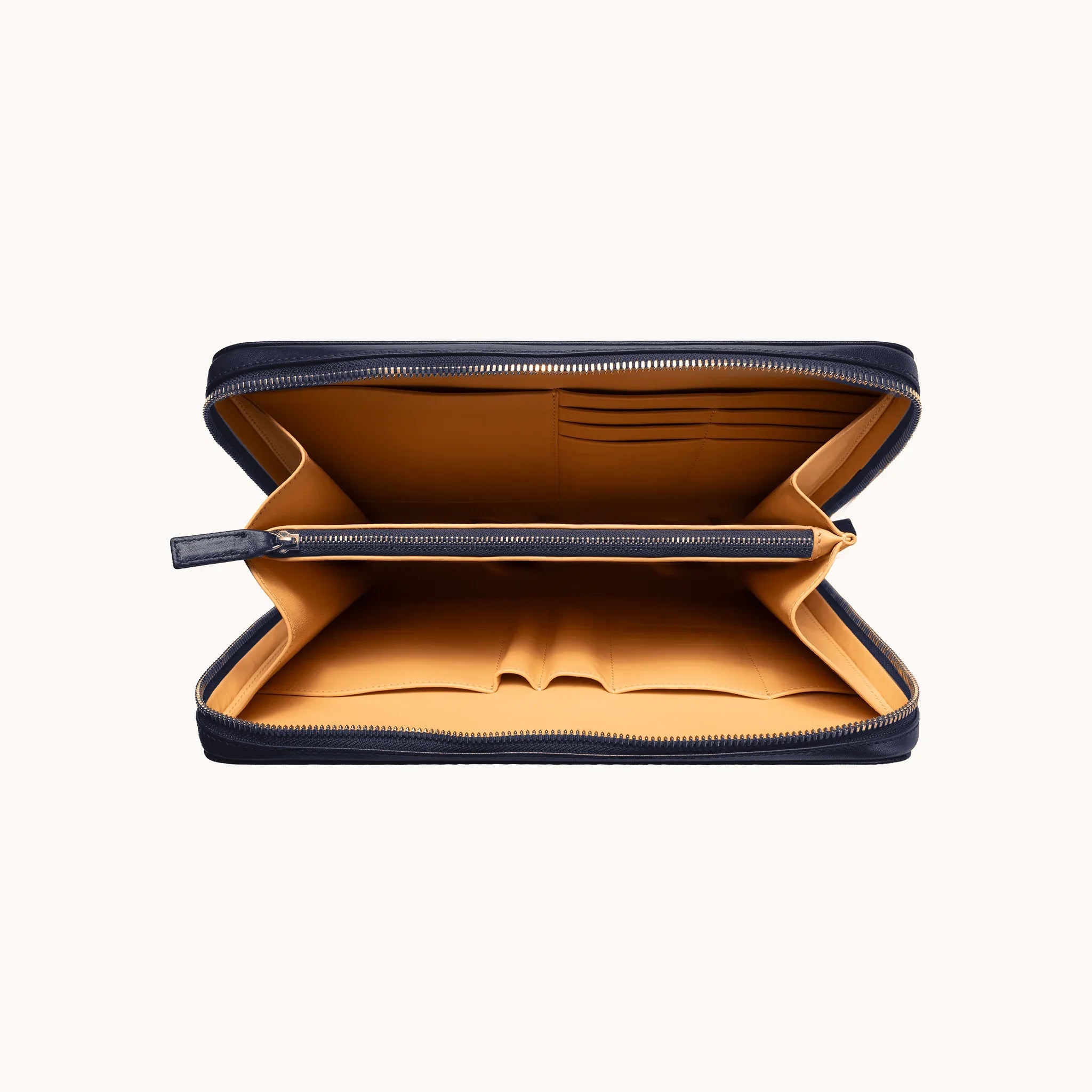 Lunburg Memoir Dossier Portfolio in Nocturnal Sapphire, open interior view showing the goat leather lining with card slots and open pockets in the upper compartment, an internal YKK Excella zipped pocket, and multiple compartments in the lower section, in vegetable-tanned Perpetual Leather (from Tempesti) with folded edge construction throughout.