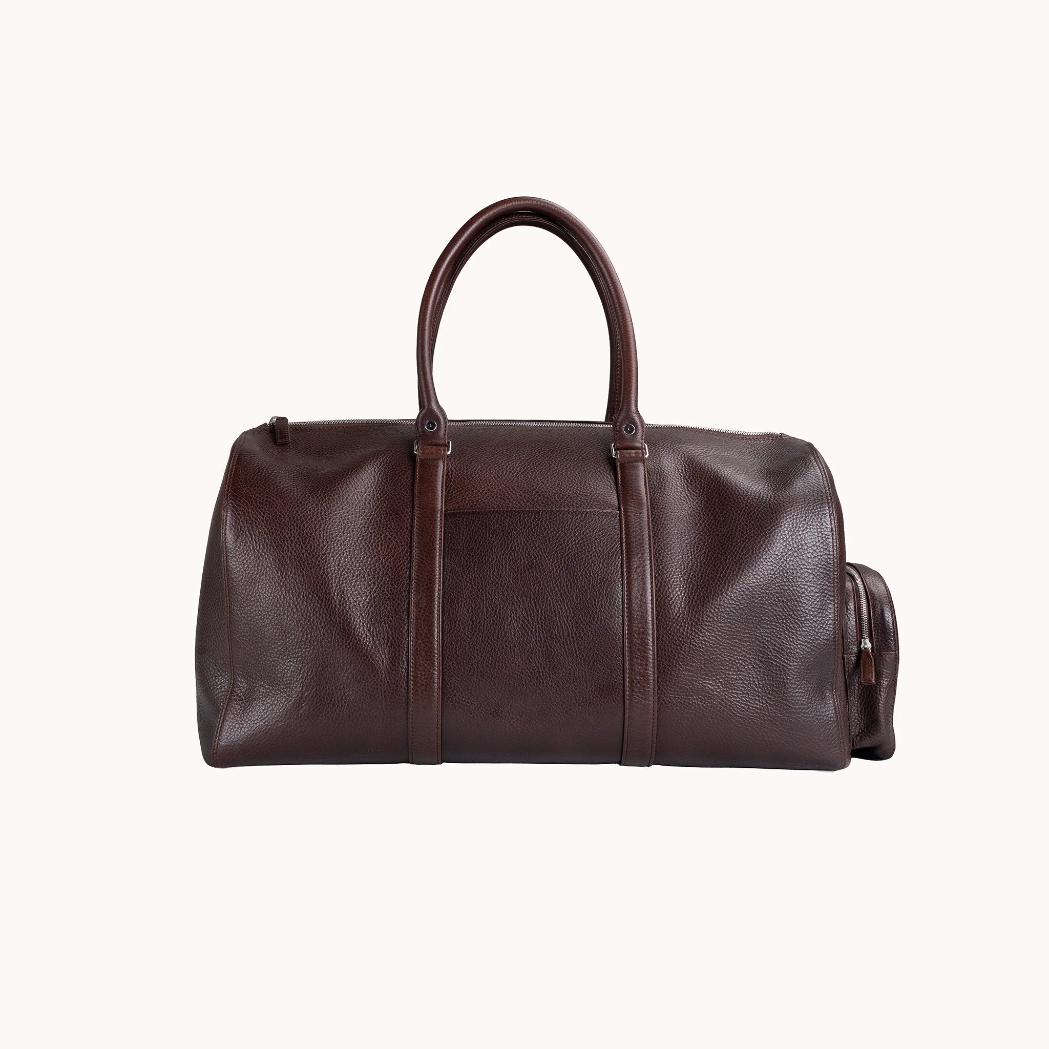 Lunburg Estate Duffle Bag in tumbled Deep Mahogany leather, front view with twin top handles and exterior trim.