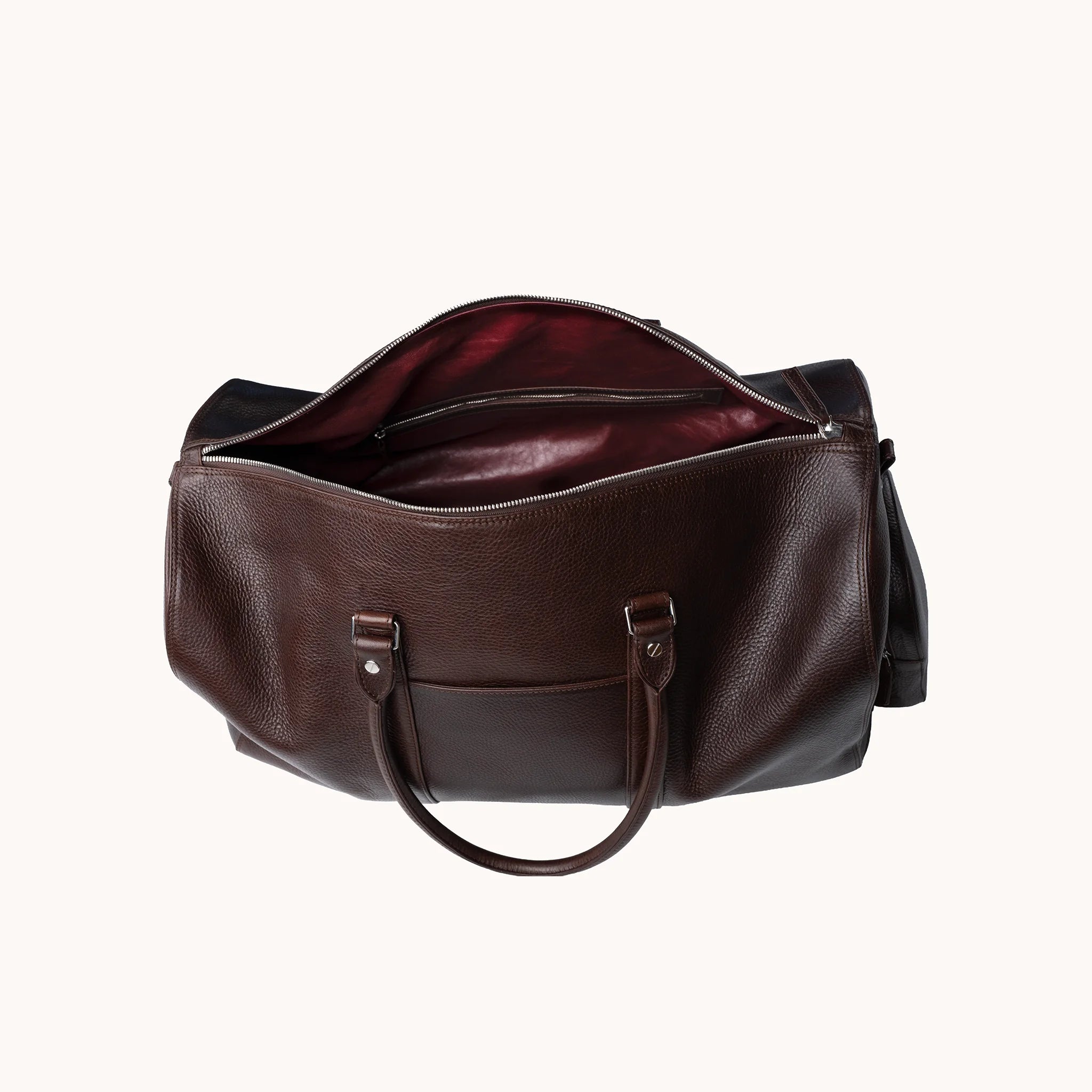 Estate Duffle Bag interior in Deep Mahogany, goat leather lining and a single main compartment for travel essentials.