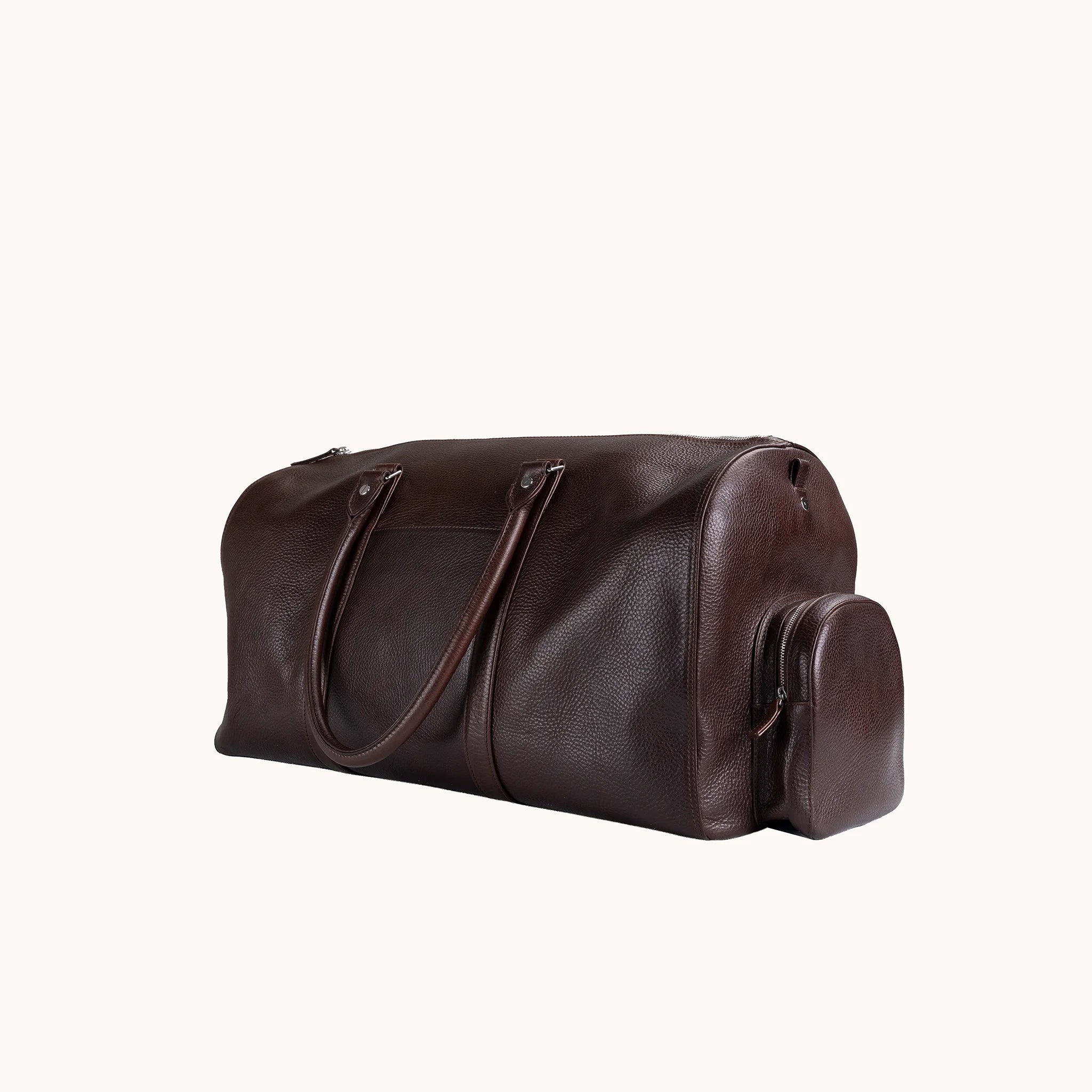 Lunburg Estate Duffle Bag in tumbled Deep Mahogany leather, three-quarter view showing depth and handle drop.