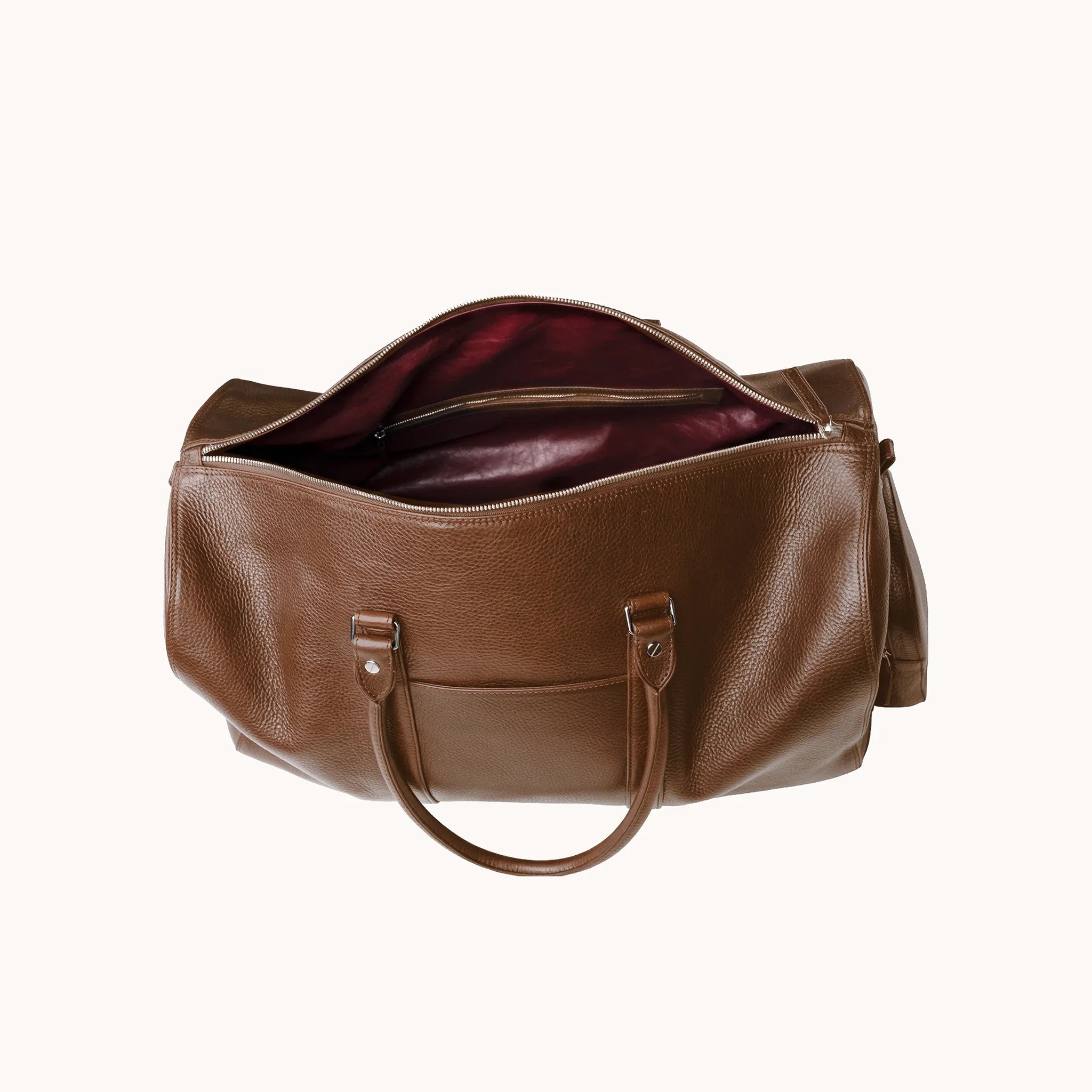 Estate Duffle Bag interior in Heritage Amber, goat leather lining and a single main compartment for travel essentials.