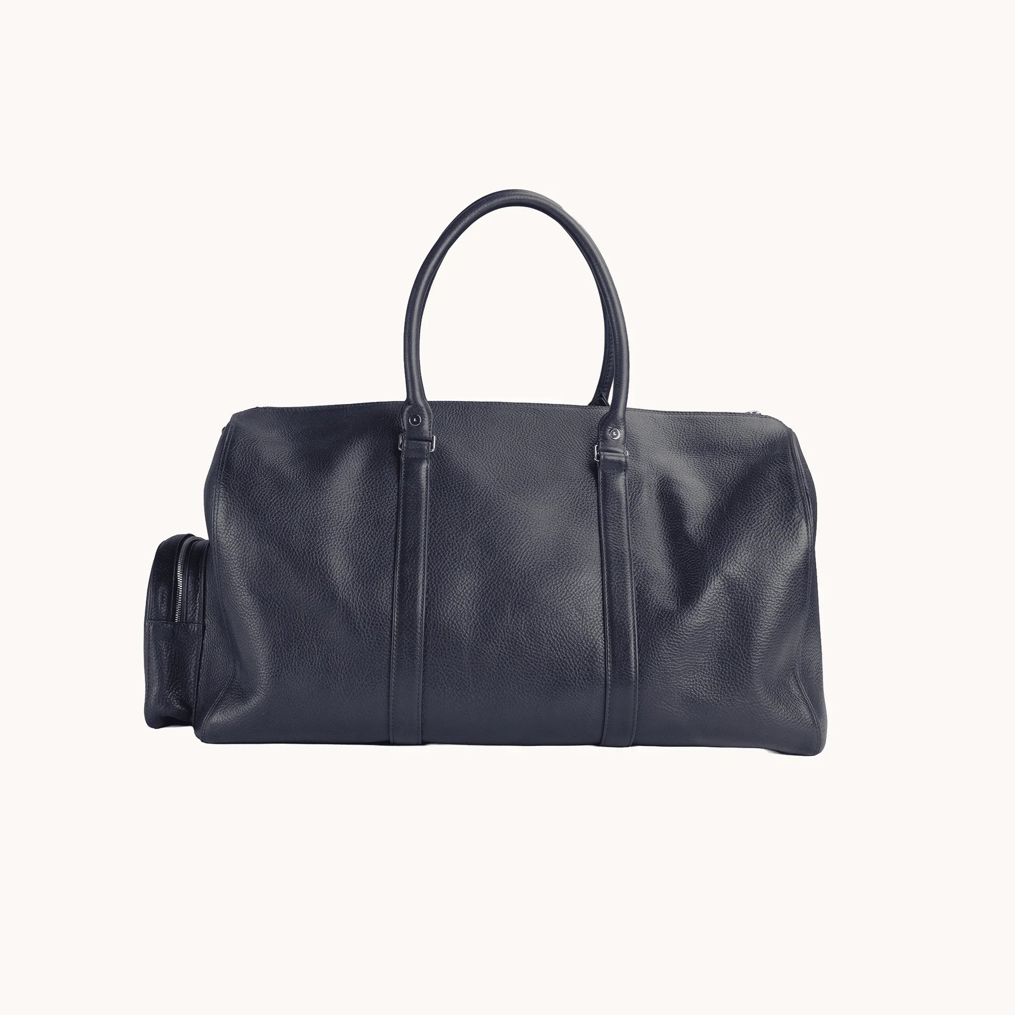 Lunburg Estate Duffle Bag in tumbled Nocturnal Sapphire leather, back view of the clean panelled body.