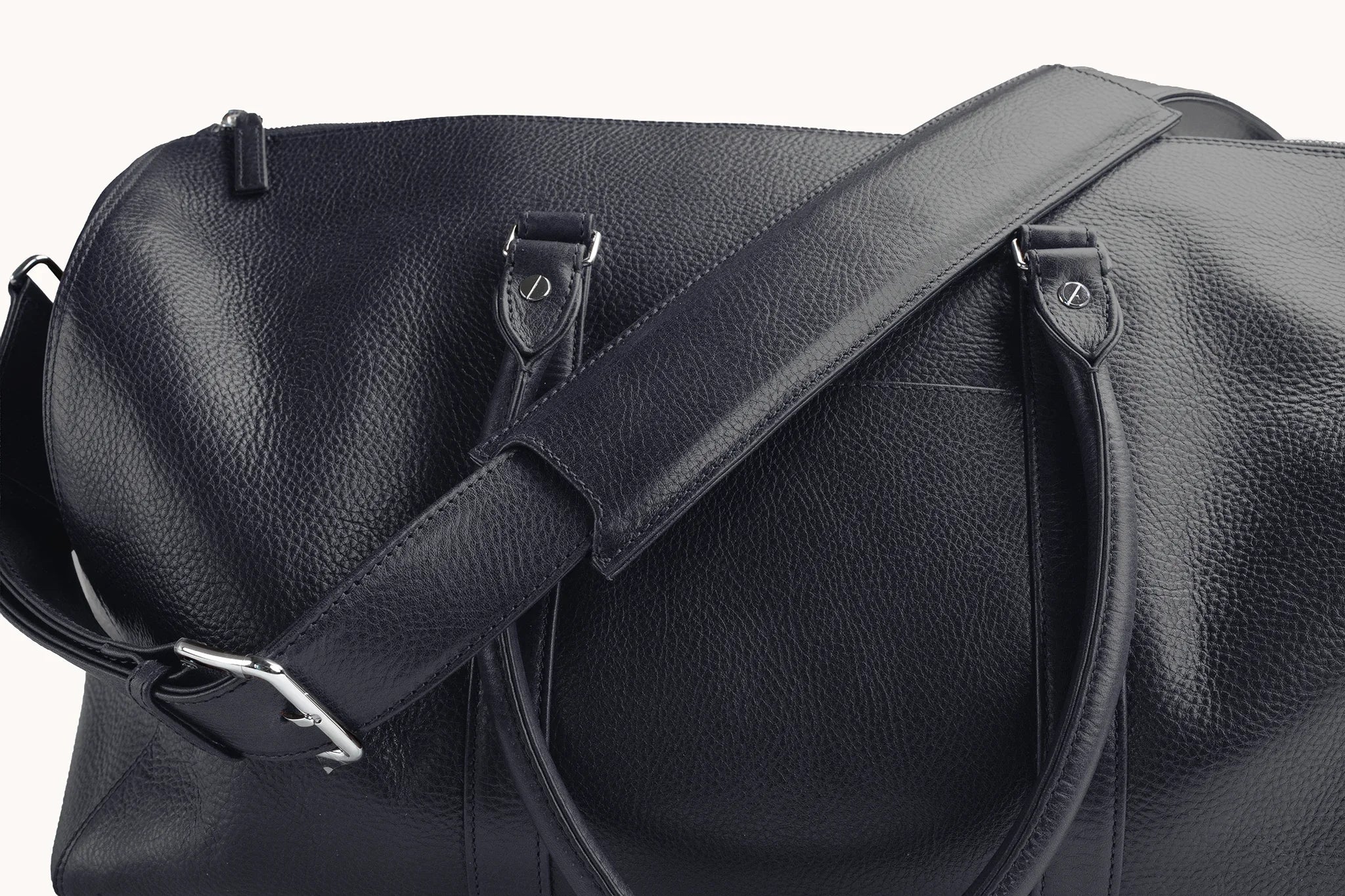 Estate Duffle Bag in Nocturnal Sapphire, twin top handles paired with the removable shoulder strap.