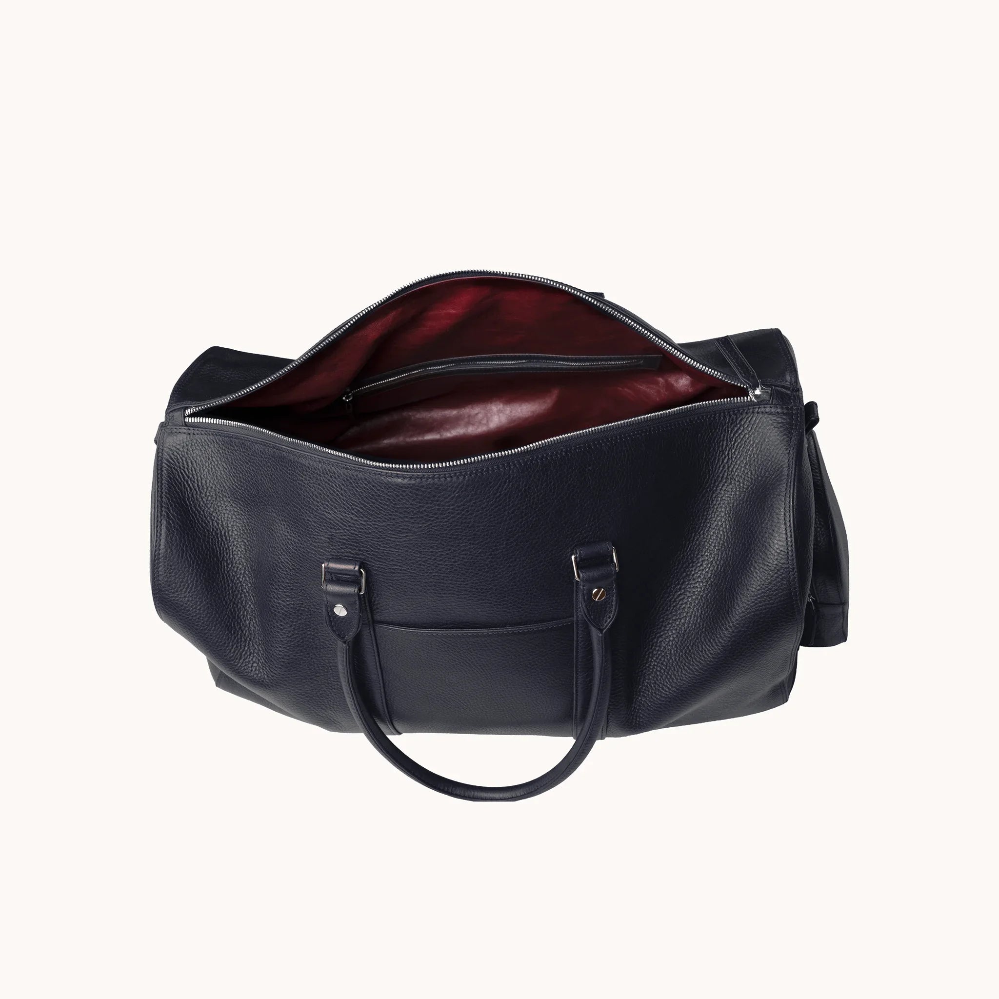 Estate Duffle Bag interior in Nocturnal Sapphire, goat leather lining and a single main compartment for travel essentials.