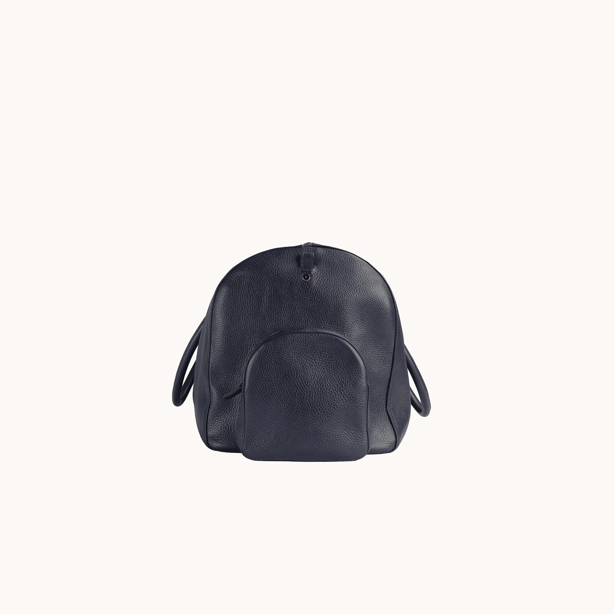 Lunburg Estate Duffle Bag in tumbled Nocturnal Sapphire leather, side profile showing volume and handle attachment.