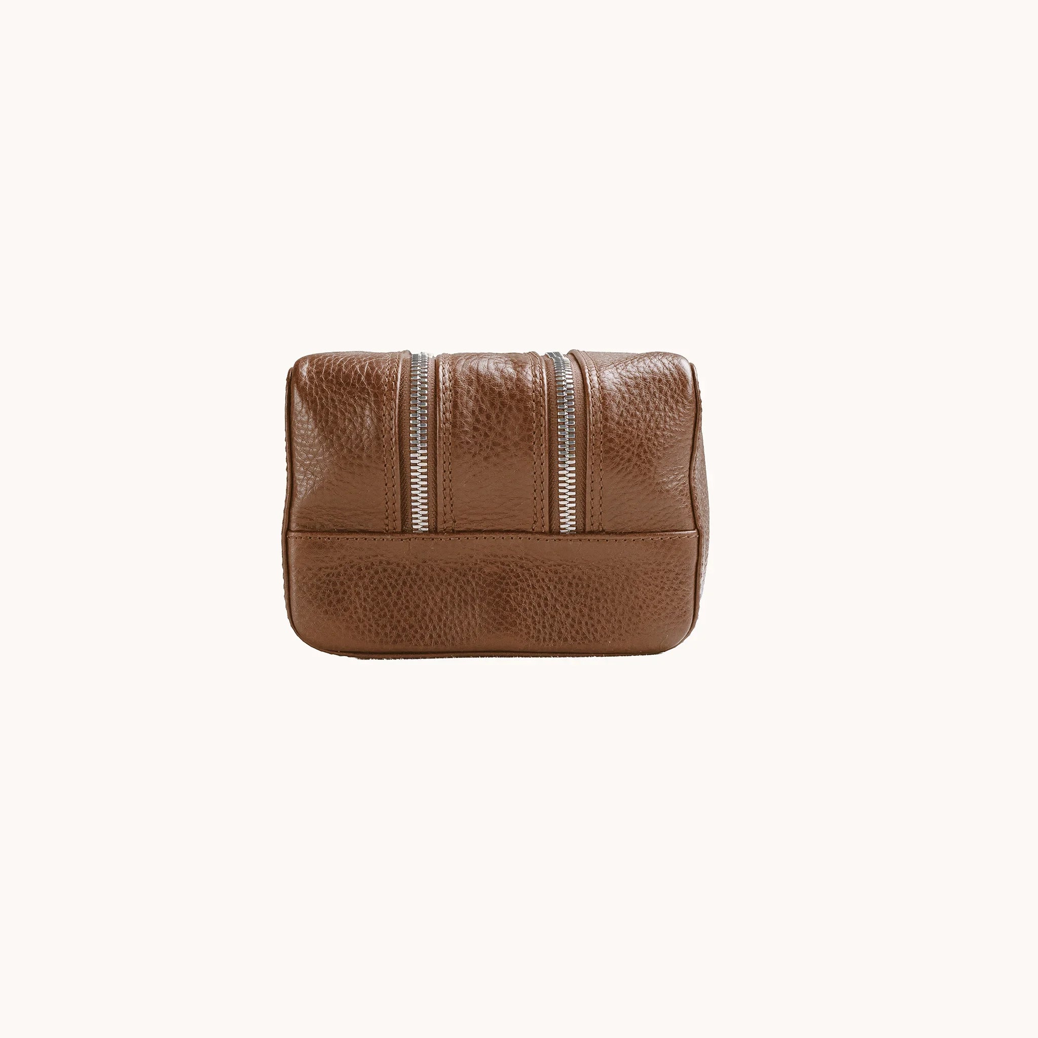 Lunburg Chamberlain Grand Toiletry Bag in tumbled Heritage Amber leather, opposite side profile with seam and base.