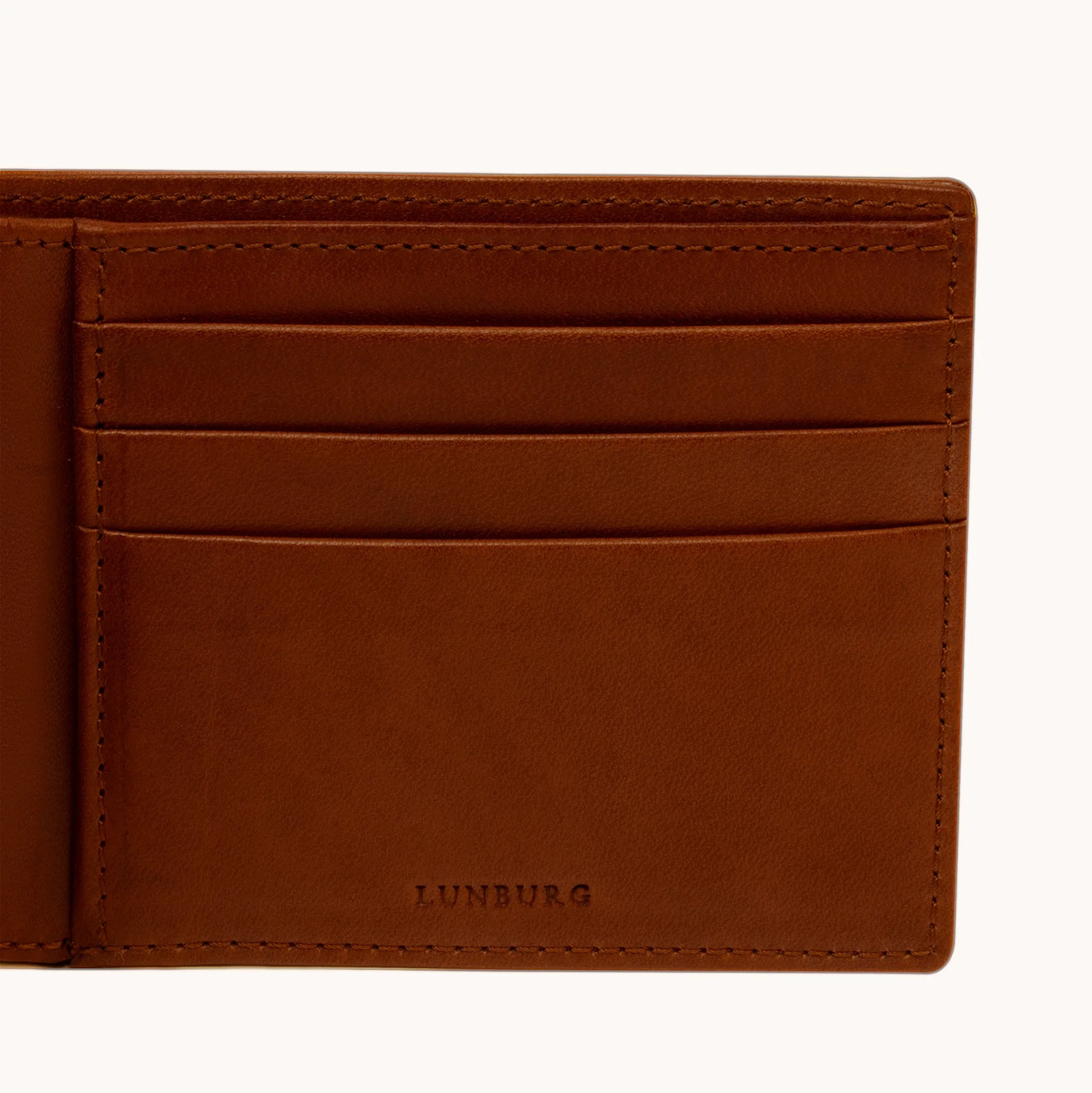 Lunburg Signet Horizontal Bifold in Deep Mahogany, detail view of the interior right panel showing the heat-embossed Lunburg mark beneath card slots in vegetable-tanned Perpetual Leather (from Tempesti) with folded edge construction throughout.