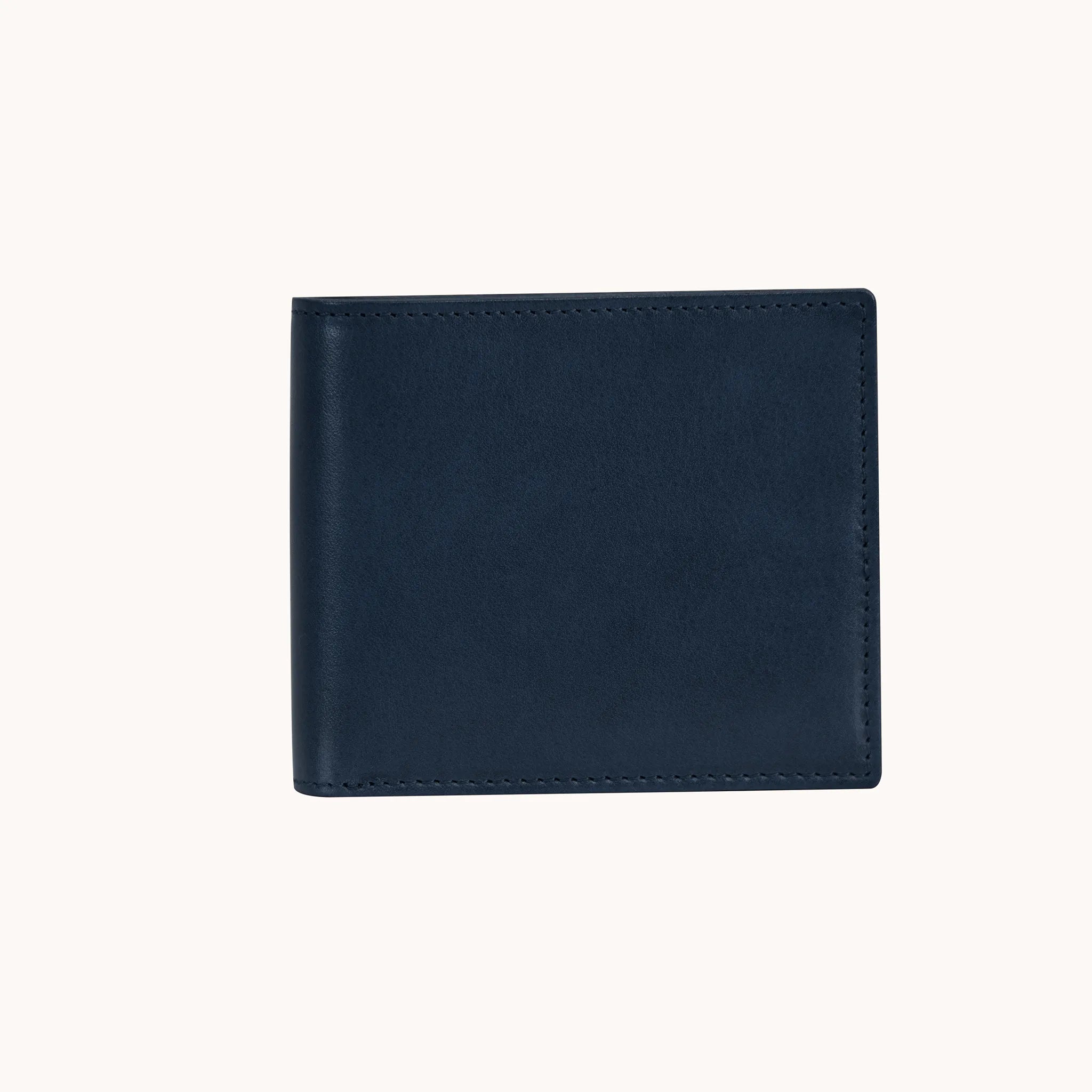 Lunburg Signet Horizontal Bifold in Nocturnal Sapphire, front view closed, showing the clean face of vegetable-tanned Perpetual Leather (from Tempesti) with folded edge construction and no visible raw edges.