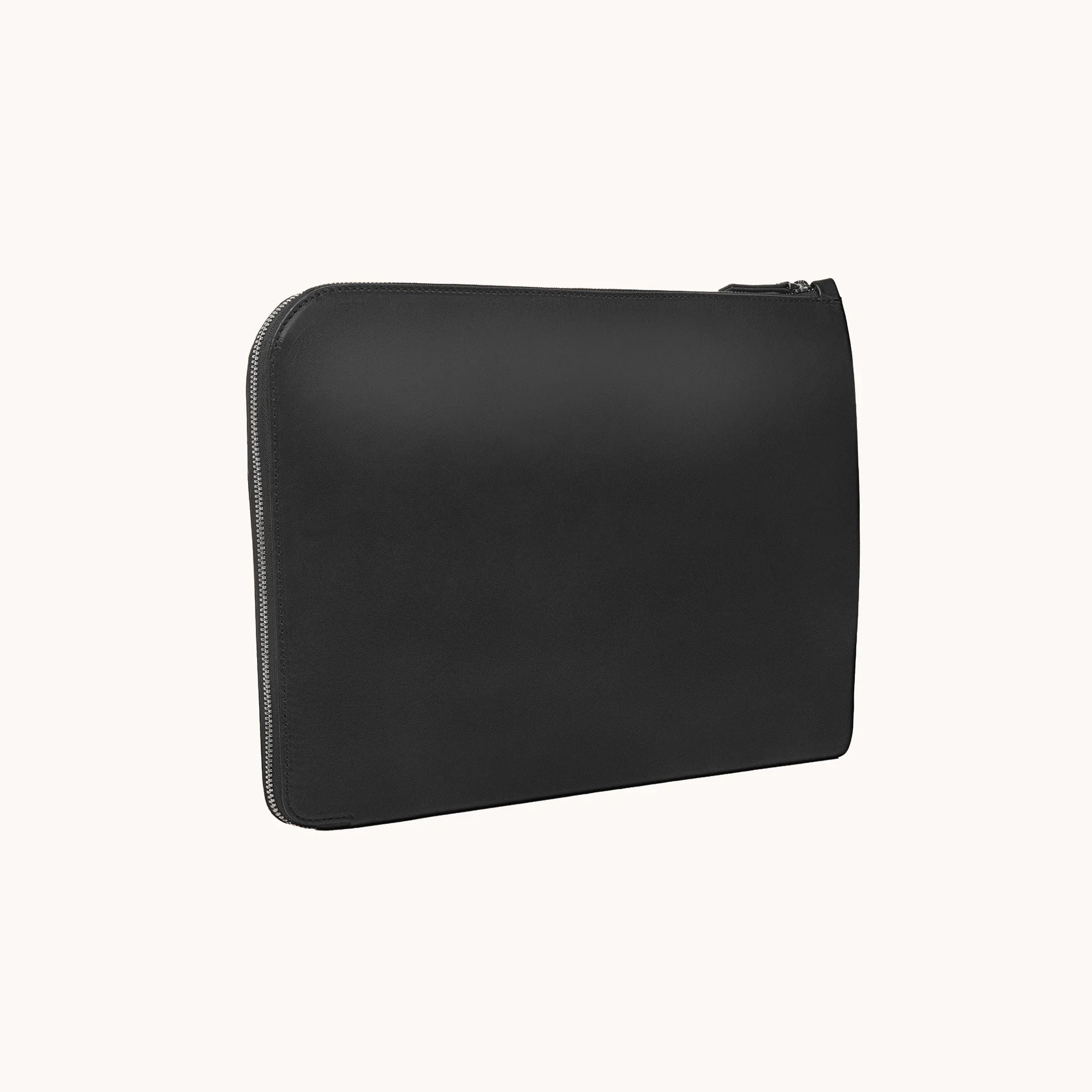 Lunburg Memoir Laptop Sleeve in Burnt Timber, three-quarter front view showing the clean face, top YKK Excella zipper, and slim profile, in vegetable-tanned Perpetual Leather (from Tempesti) with folded edge construction.